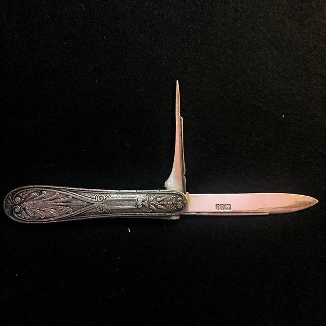 First in the series of Victorian ladies knives. This one is in a beautiful sterling handle reminiscent of antique flatware. The blade has three symbols embossed in the blade, typical silversmithing cartouches that not only indicate where it came from