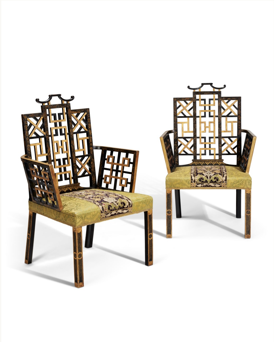 A PAIR OF GEORGE II BLACK-JAPANNED AND PARCEL-GILT ARMCHAIRS.png