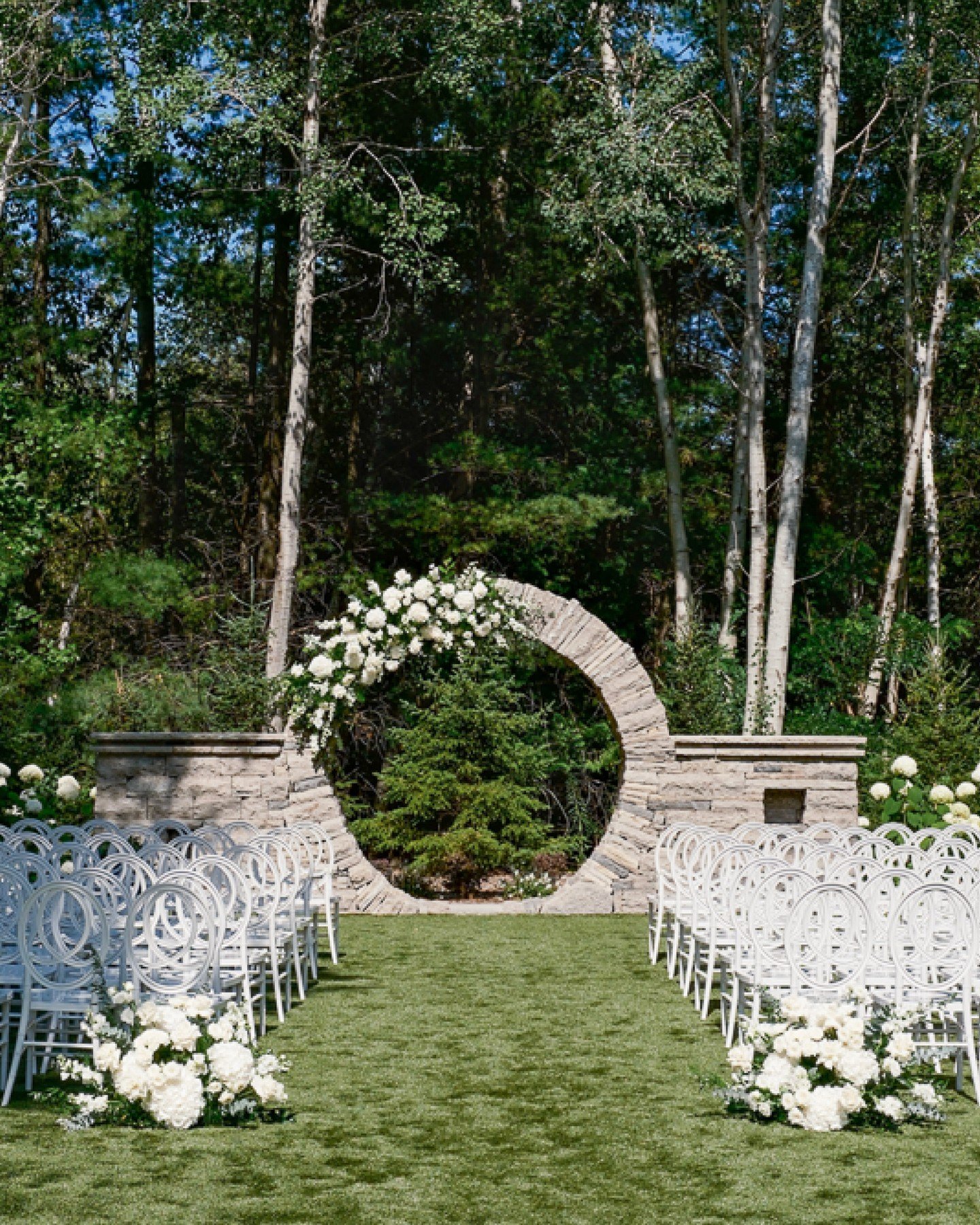 G&amp;S's wedding featured a gorgeous arch set up. This arrangement was fully created and installed on the spot to ensure a perfectly proportional and custom fit to the venue's unique moon arch. In the heat of August summers, we have to consider the 