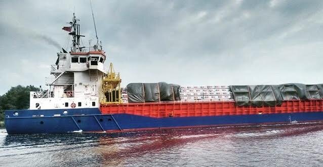 Cargo ships connecting trade links between different countries on the Kiel Canal