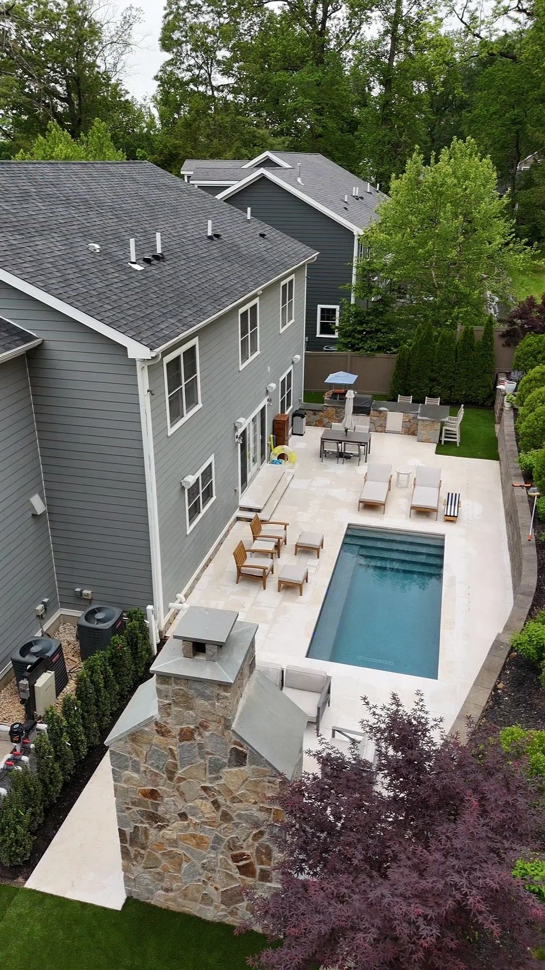 barrasso pool outdoor fireplace outdoor kitchen.jpeg