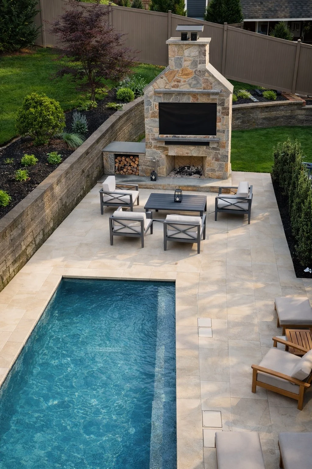 barrasso pool outdoor fireplace.jpeg