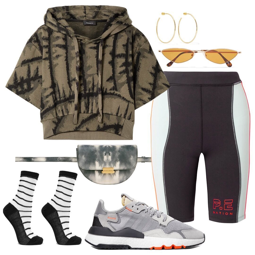  Earrings: Jennifer Fisher | Sunglasses: Andy Wolf | Top: Twenty | Shorts: P.E. Nation | Bag: Wandler | Socks: Wolford | Shoes: Nike    Fully embrace the athletic roots of bike shorts and go all the way with the sporty vibes. For the perfect lowkey w