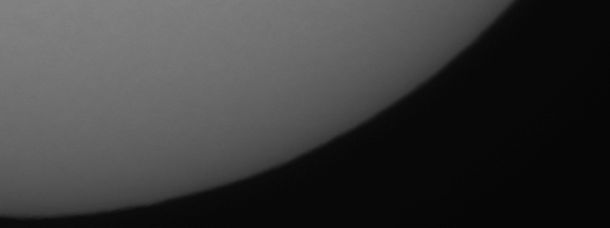 Title: Earth’s Crescent at the Edge of Light