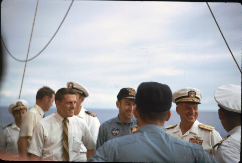 James Lovell is on deck minutes after arriving, with Rear Admiral Donald C. Davis, Commander of Task Force 130, the manned spacecraft recovery group.