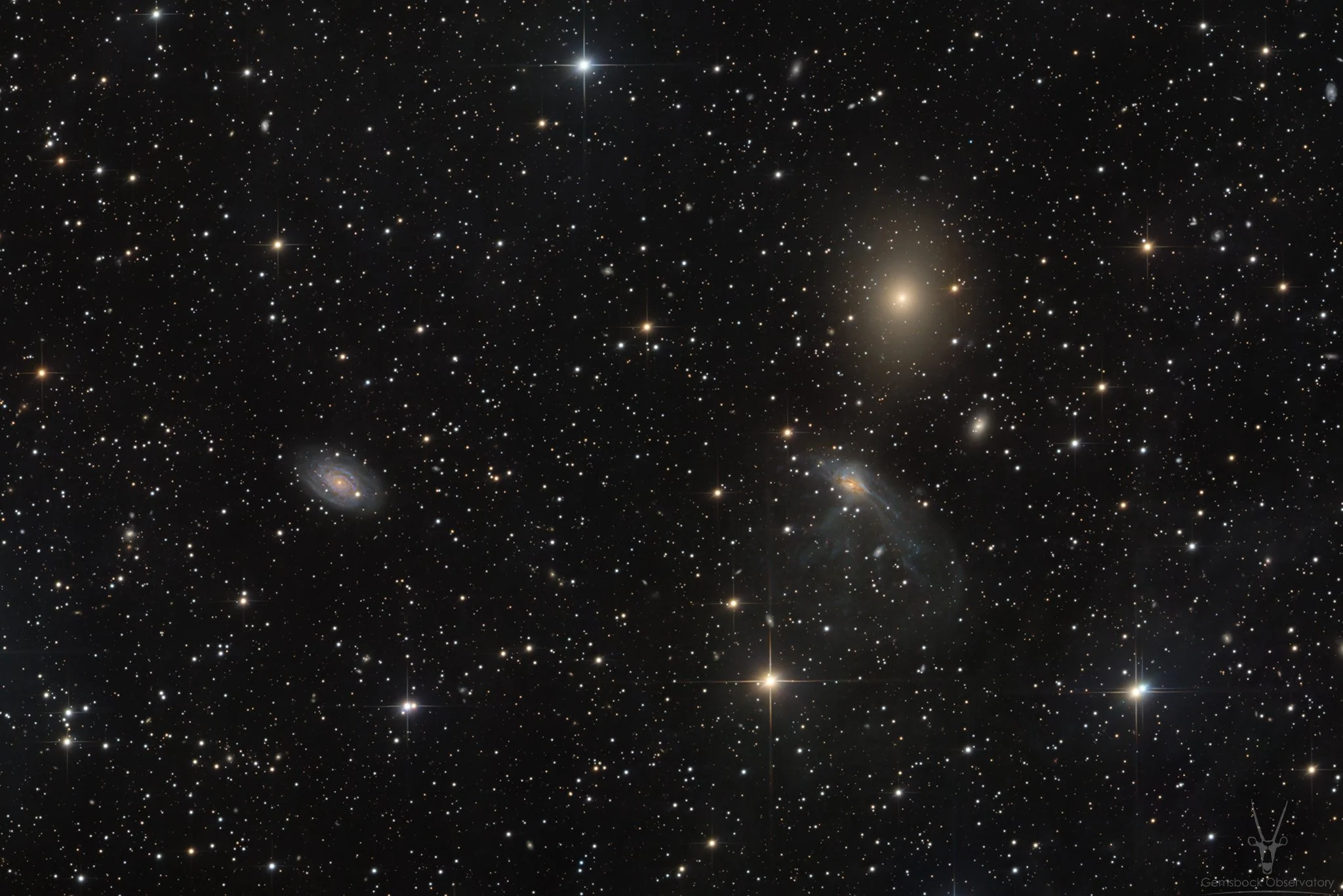 IC 4705 - distorted galaxy with 2 different neighbors