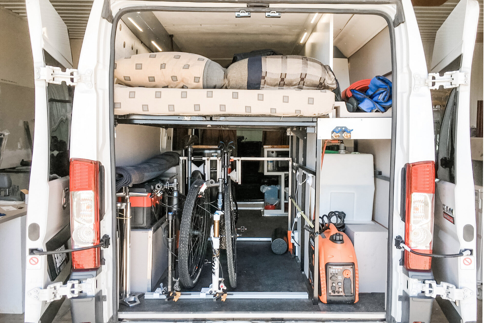 Rear doors open to access "garage"