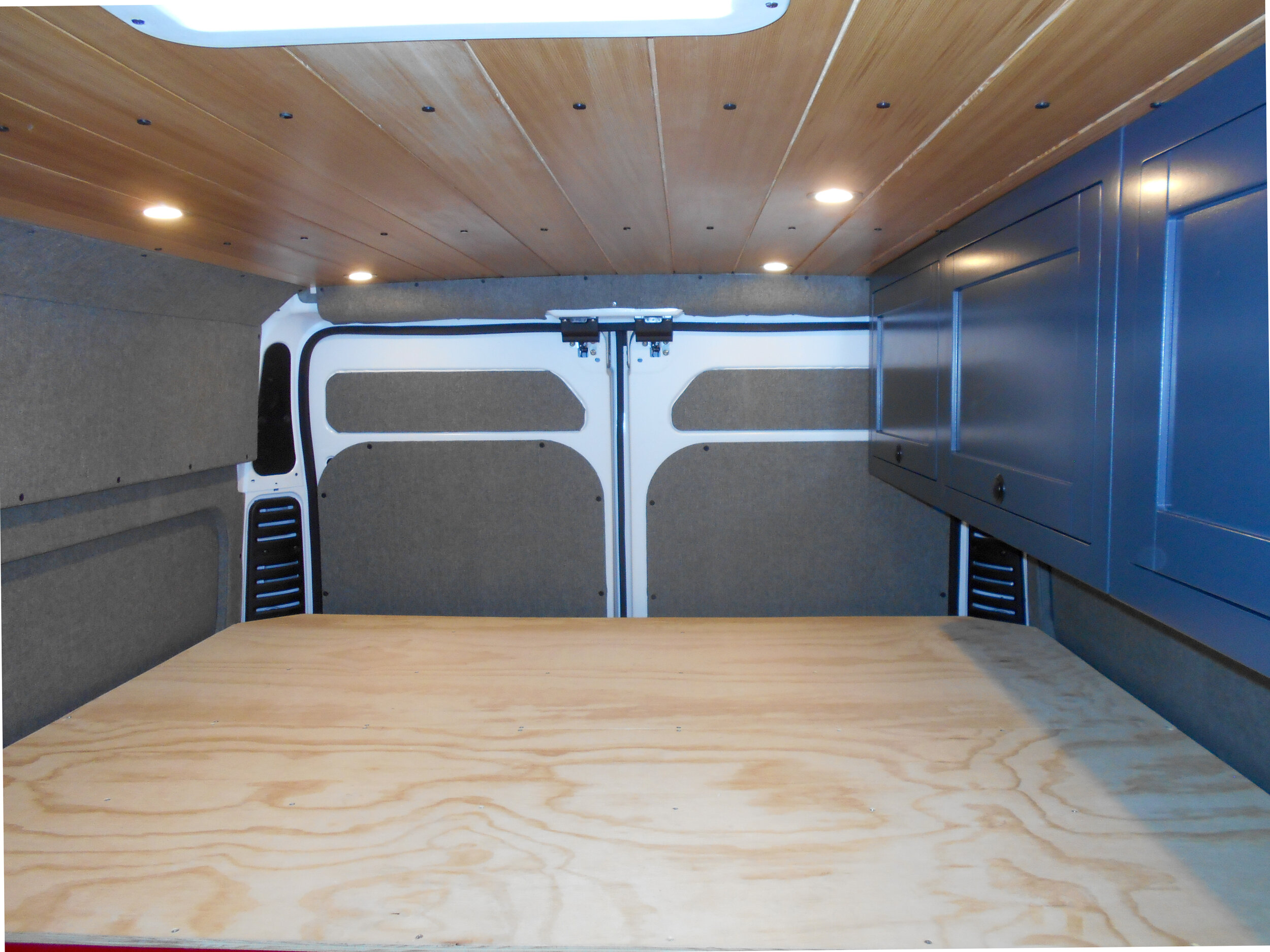 Bed platform, looking toward rear doors of van