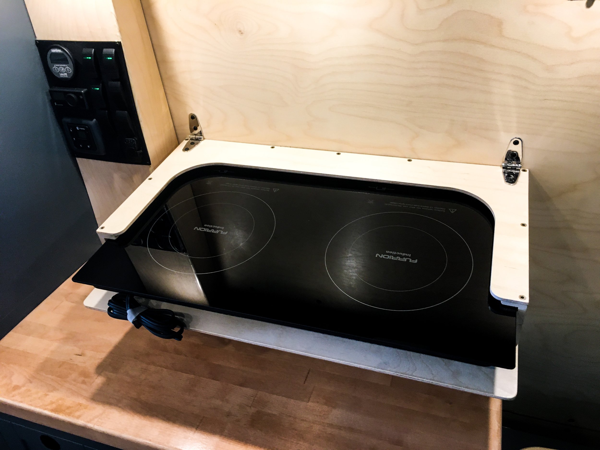 Fold-down cooktop