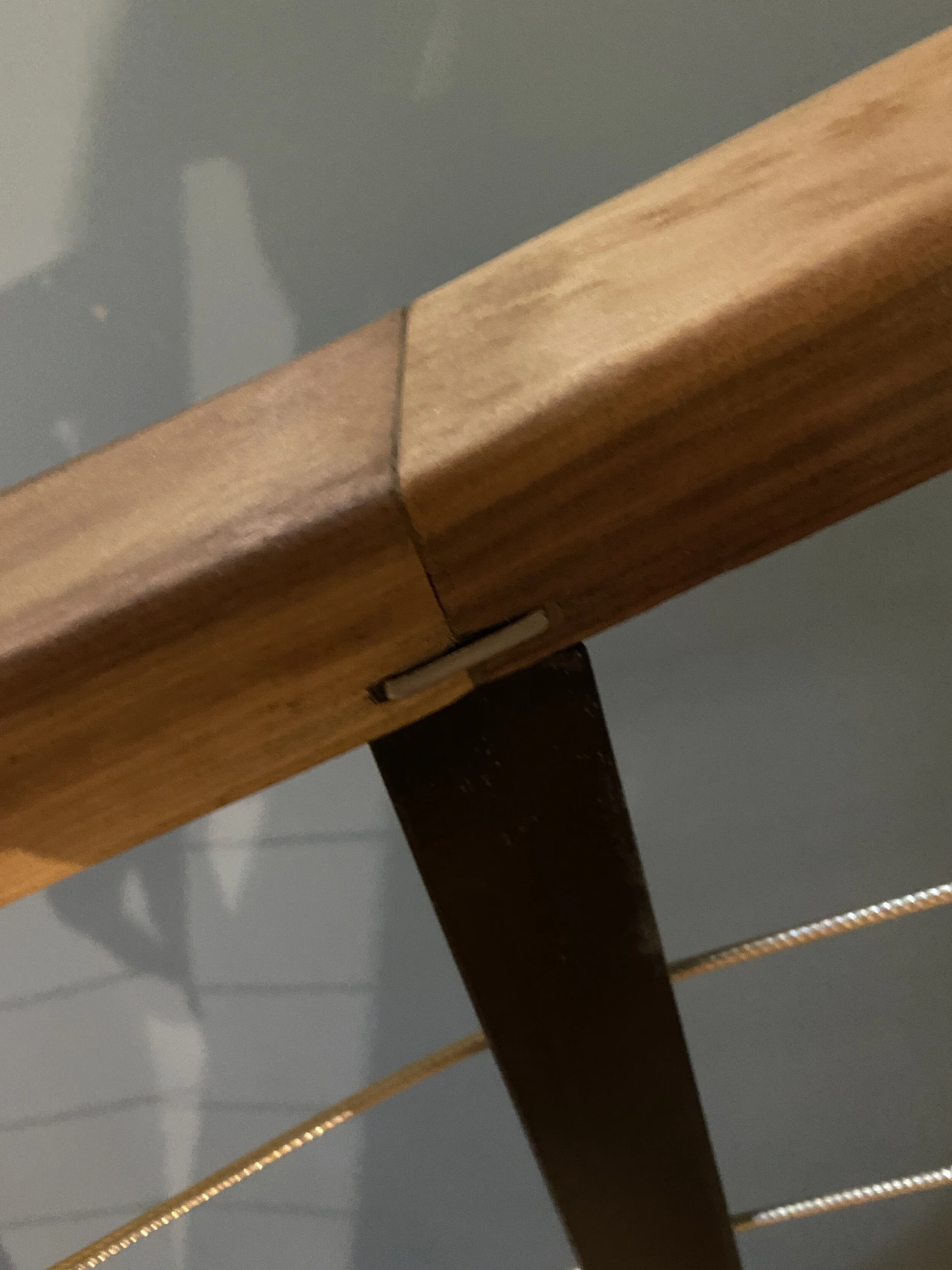 HUMMEL STAIR - Glulam beam steps with Walnut spacers, painted steel structure and Walnut railing with stainless steel cables