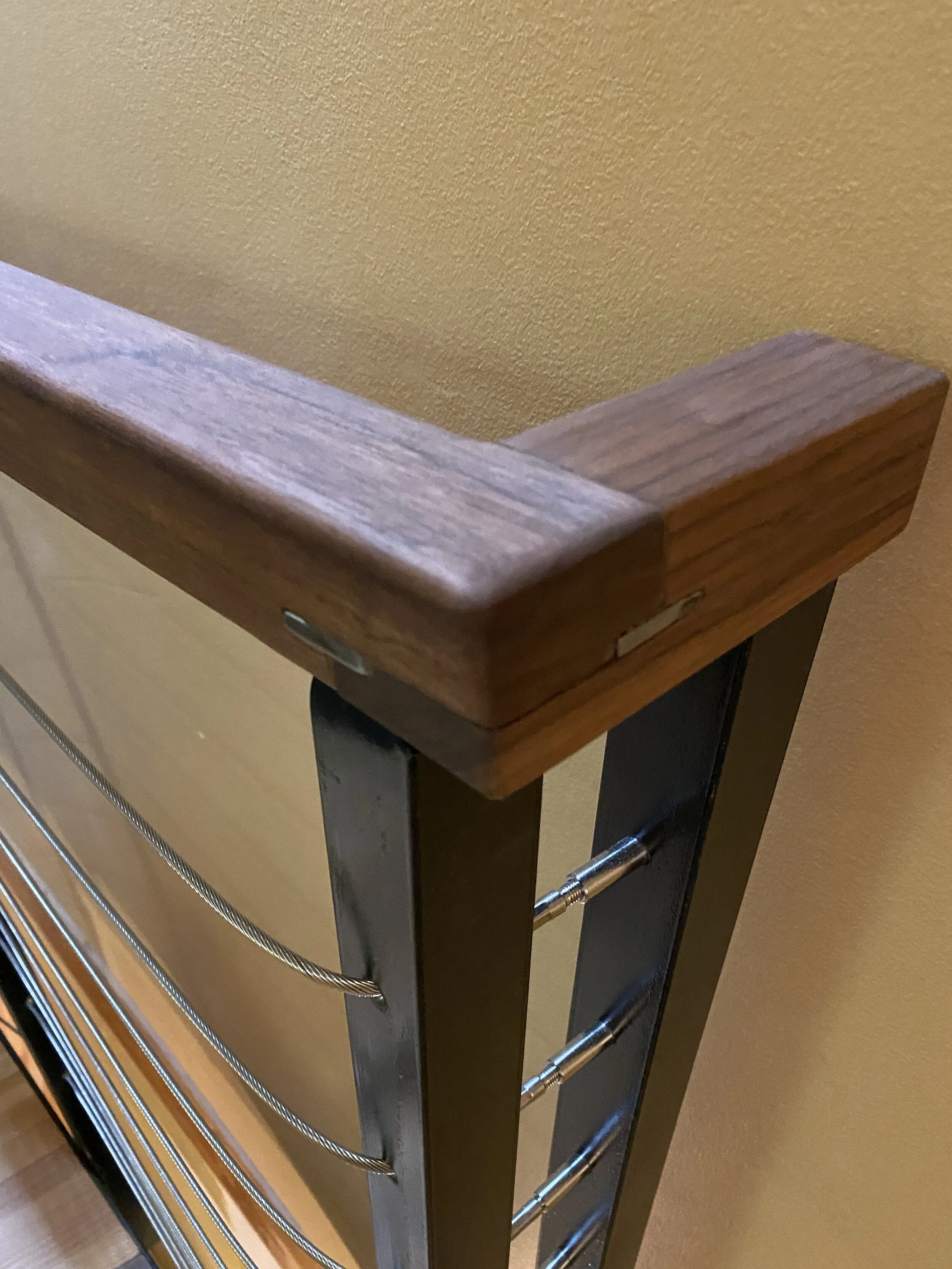 HUMMEL STAIR - Glulam beam steps with Walnut spacers, painted steel structure and Walnut railing with stainless steel cables