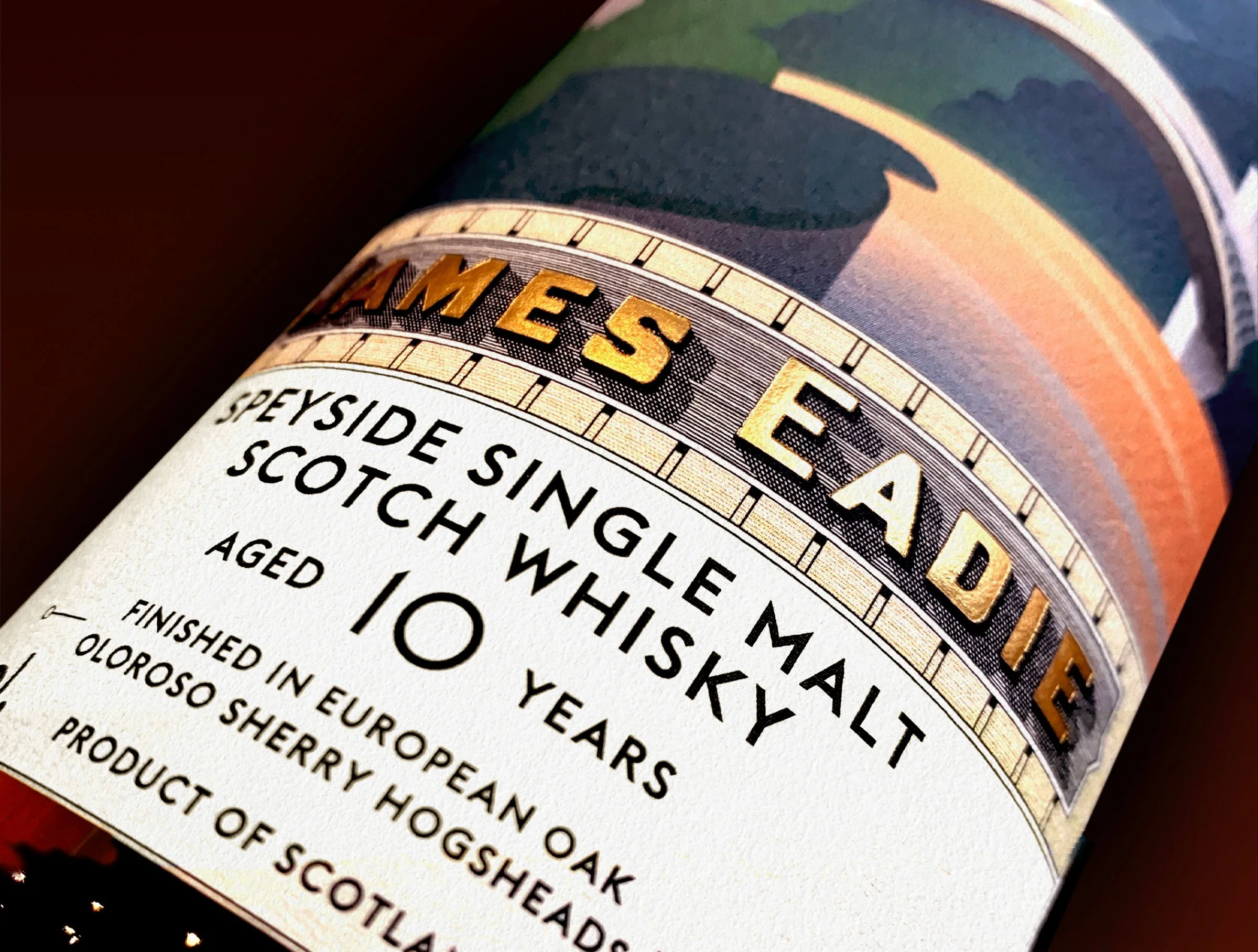 Close up detail image of the Speyside bottle, focusing on the typography and the gold foil element of the label