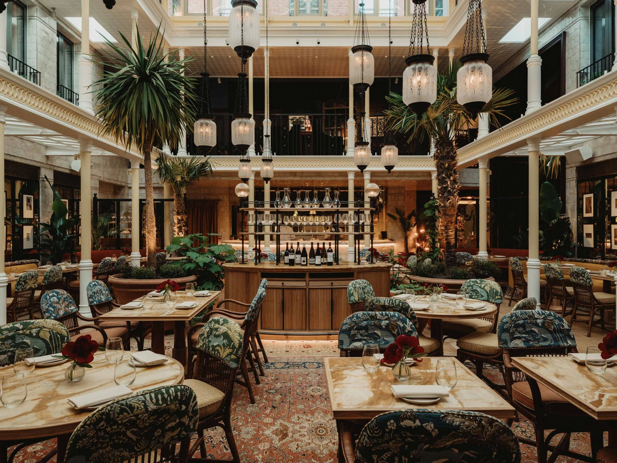 Image of the Nomad restaurant in green, cream and brown tones