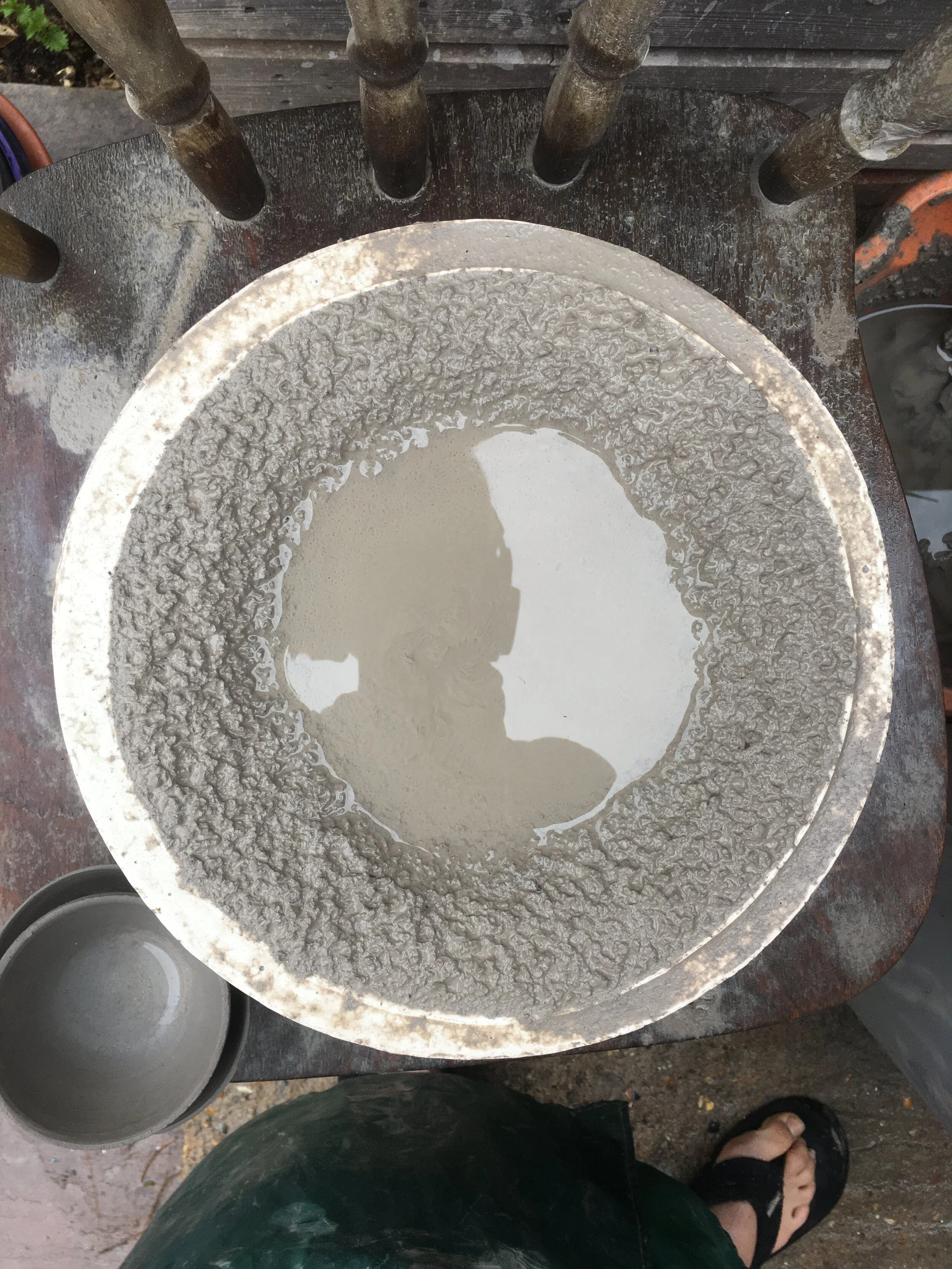 Stoneware in plaster mold after a rain shower