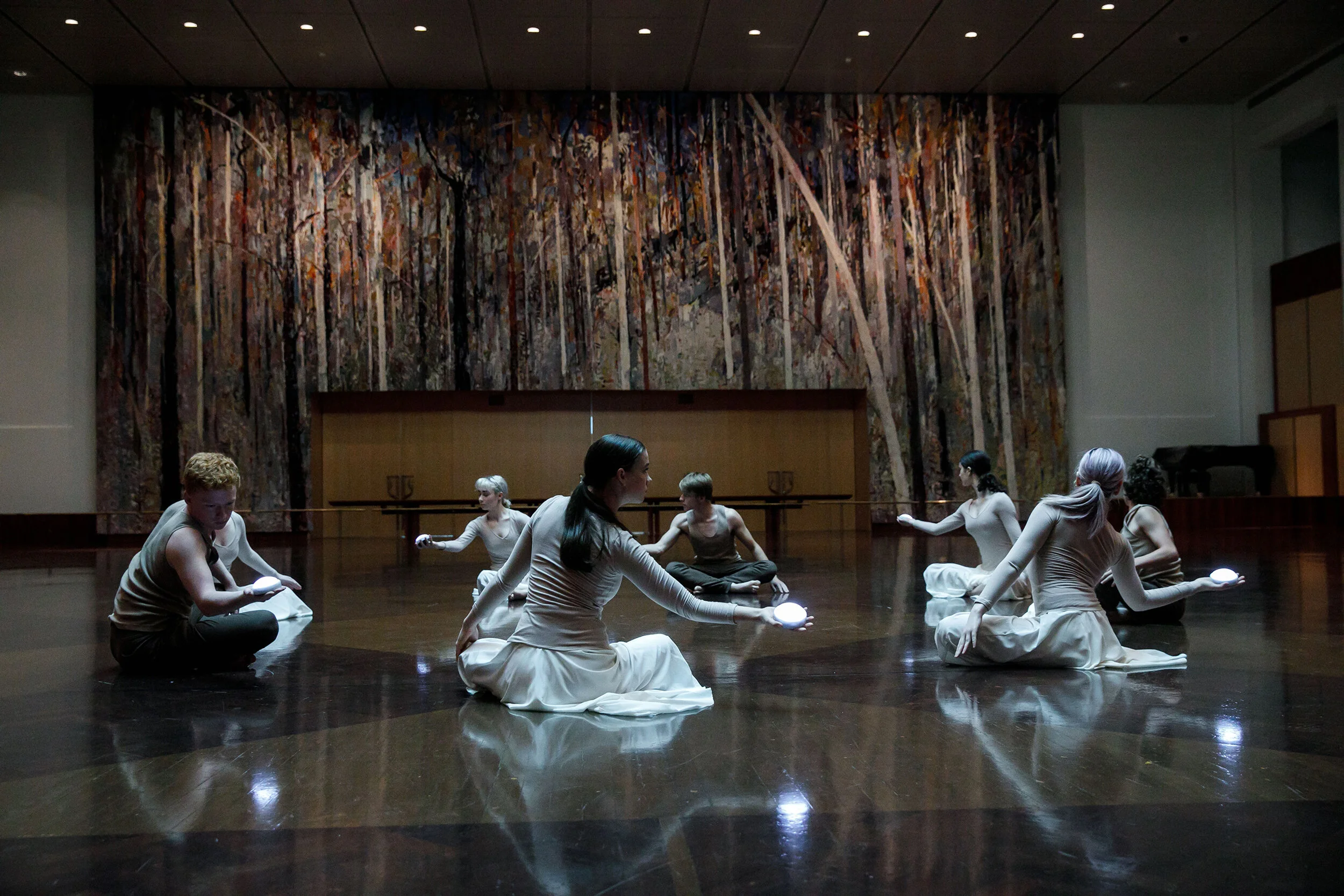 QL2 Dance_eight youth dancers with glowing lights at Parliament House hall.jpg
