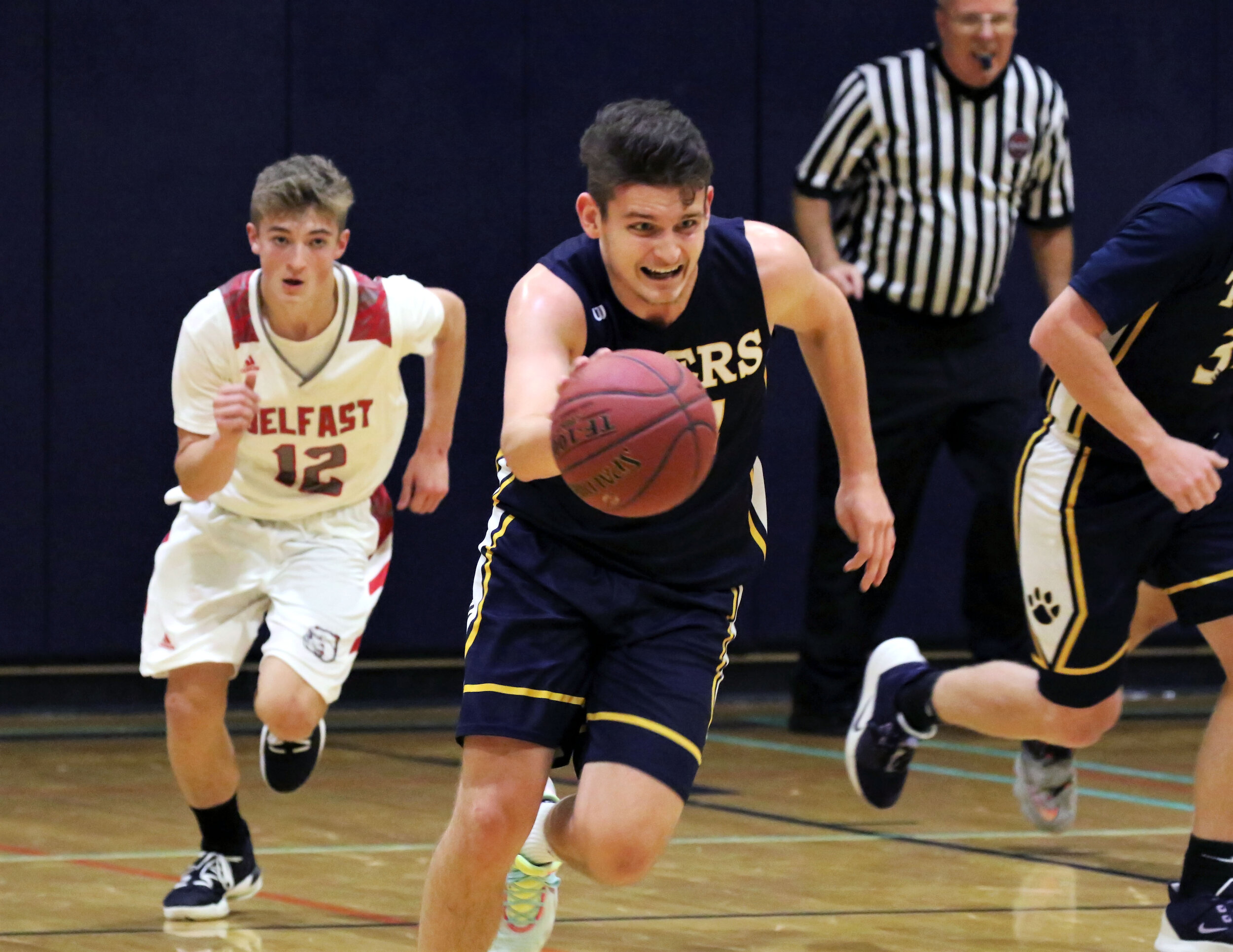  Scio senior Brendan Graves, center, pushes the pace downcourt as Belfast sophomore Matt Weaver, left, races back to defend during their matchup earlier this season. The Tigers are the second of Allegany County’s newest additions to the latest New Yo