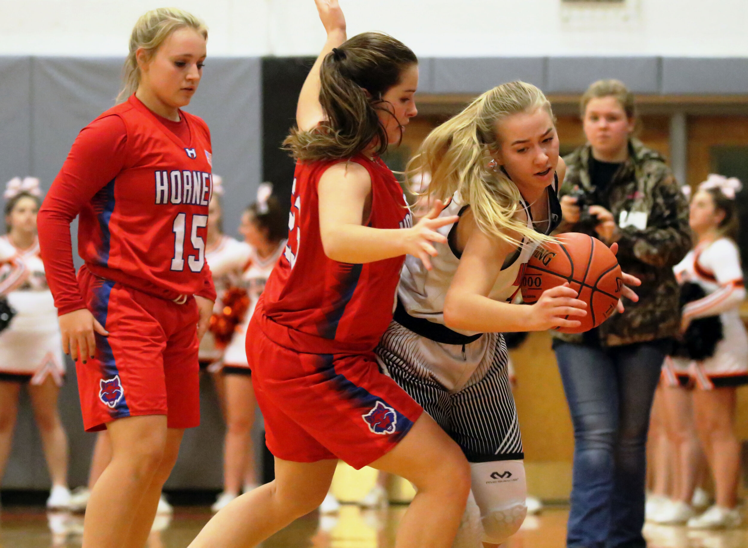  Wellsville sophomore Jaylynn Mess, right, fights her way through the Hornell defense near the sidelines during Friday’s home contest. [Chris Brooks/WellsvilleSports.com] 