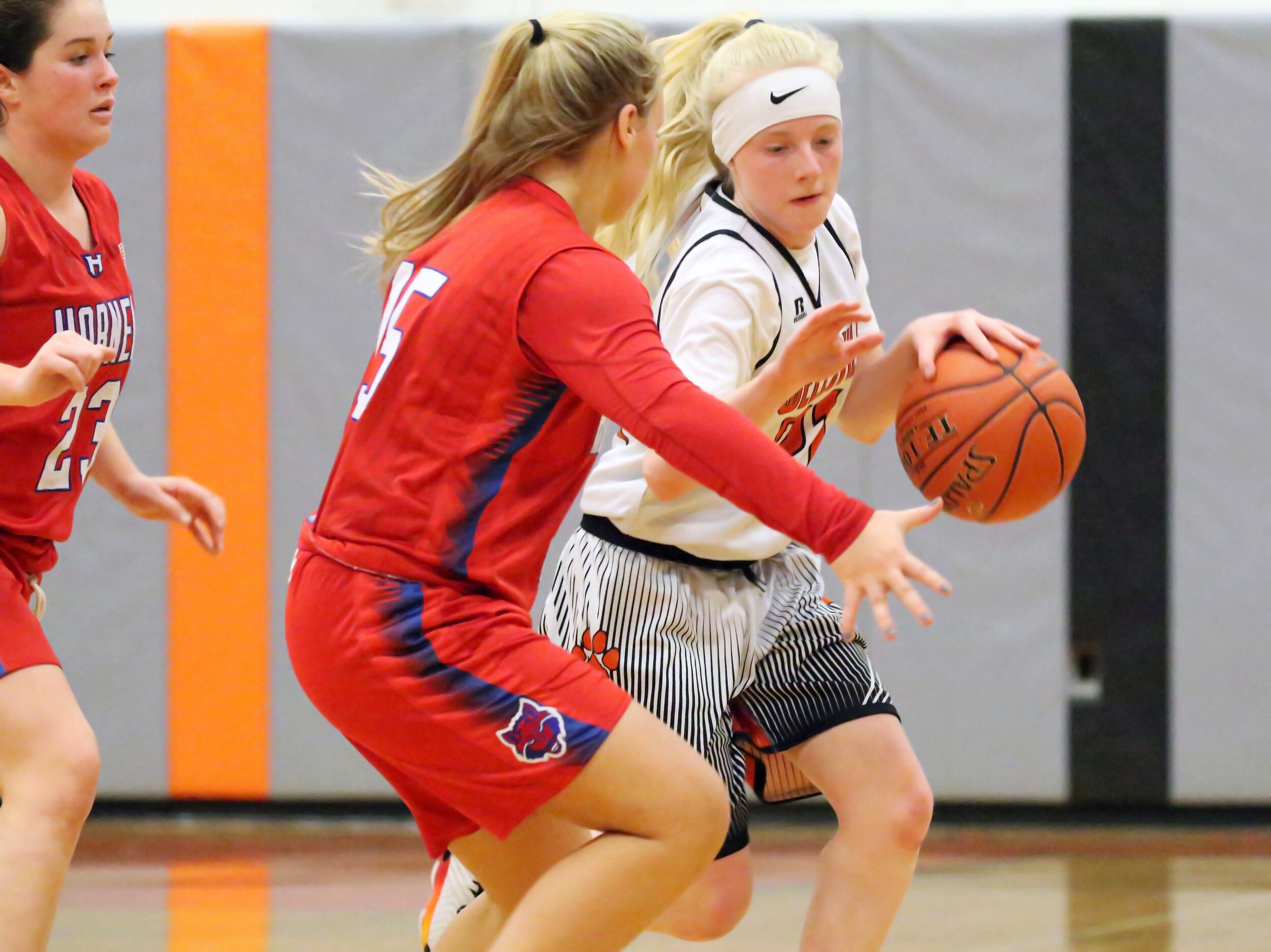  Wellsville freshman Emily Robbins, right, dribbles under pressure from the Hornell defense during Friday’s home contest. [Chris Brooks/WellsvilleSports.com] 