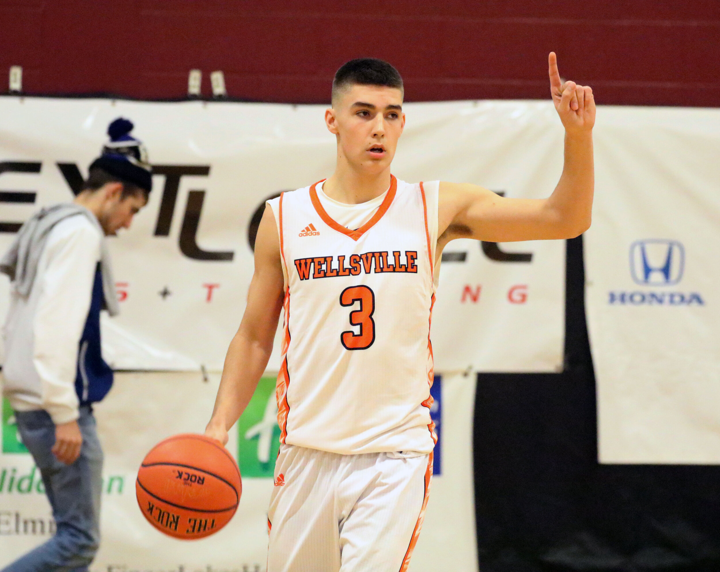 Wellsville senior Max Jusianiec (3) calls out a play as he makes his way down the court during their contest against North Penn-Mansfield earlier this week in Elmira. The Lions bounced back in the Consolation round of tournament action at Watkins Gl