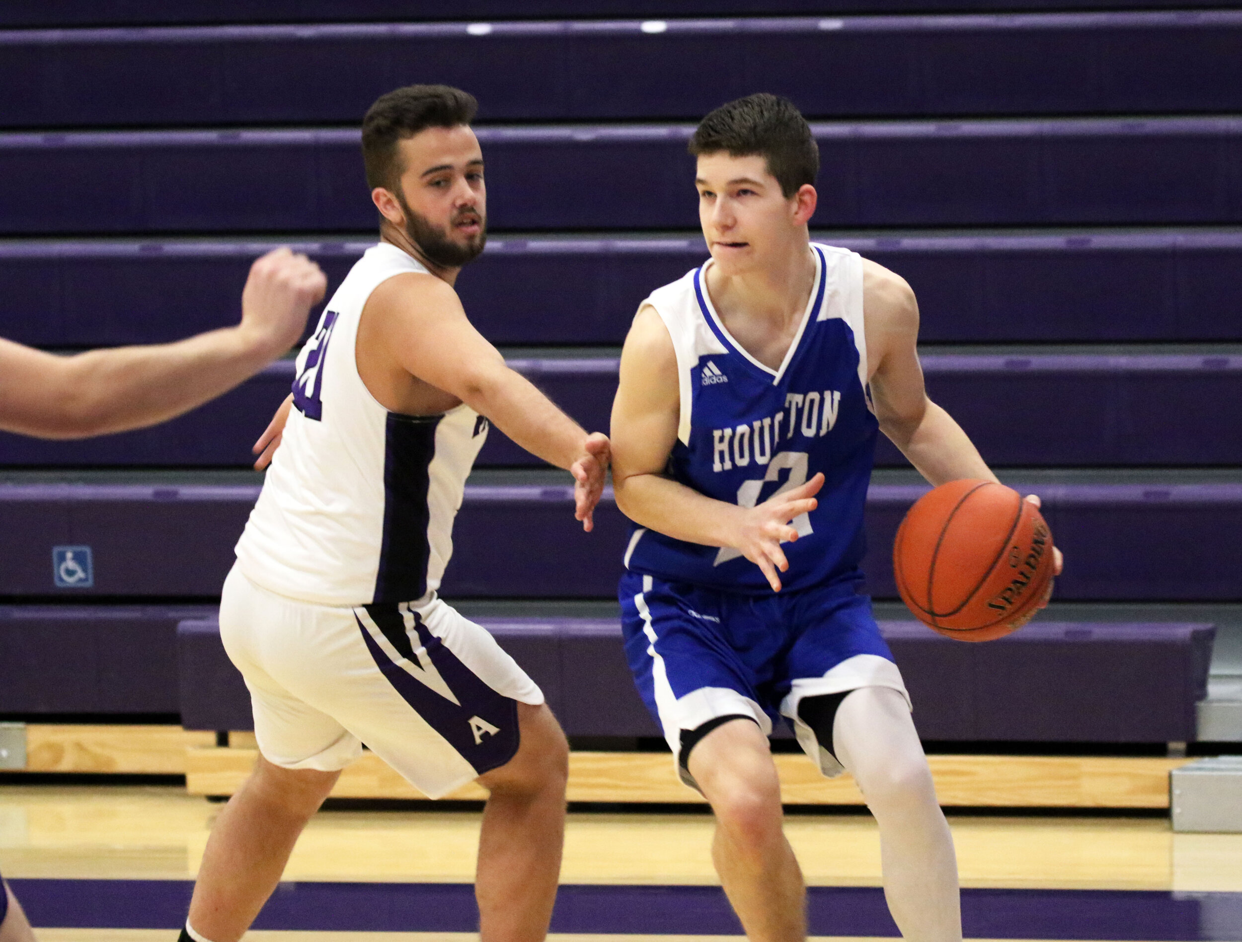  Houghton Academy senior Lee Murray (22) looks to make his way inside toward the basket, as Andover senior Preston Ordway, left, defends during Monday night’s road contest in Andover. [Chris Brooks/WellsvilleSports.com] 