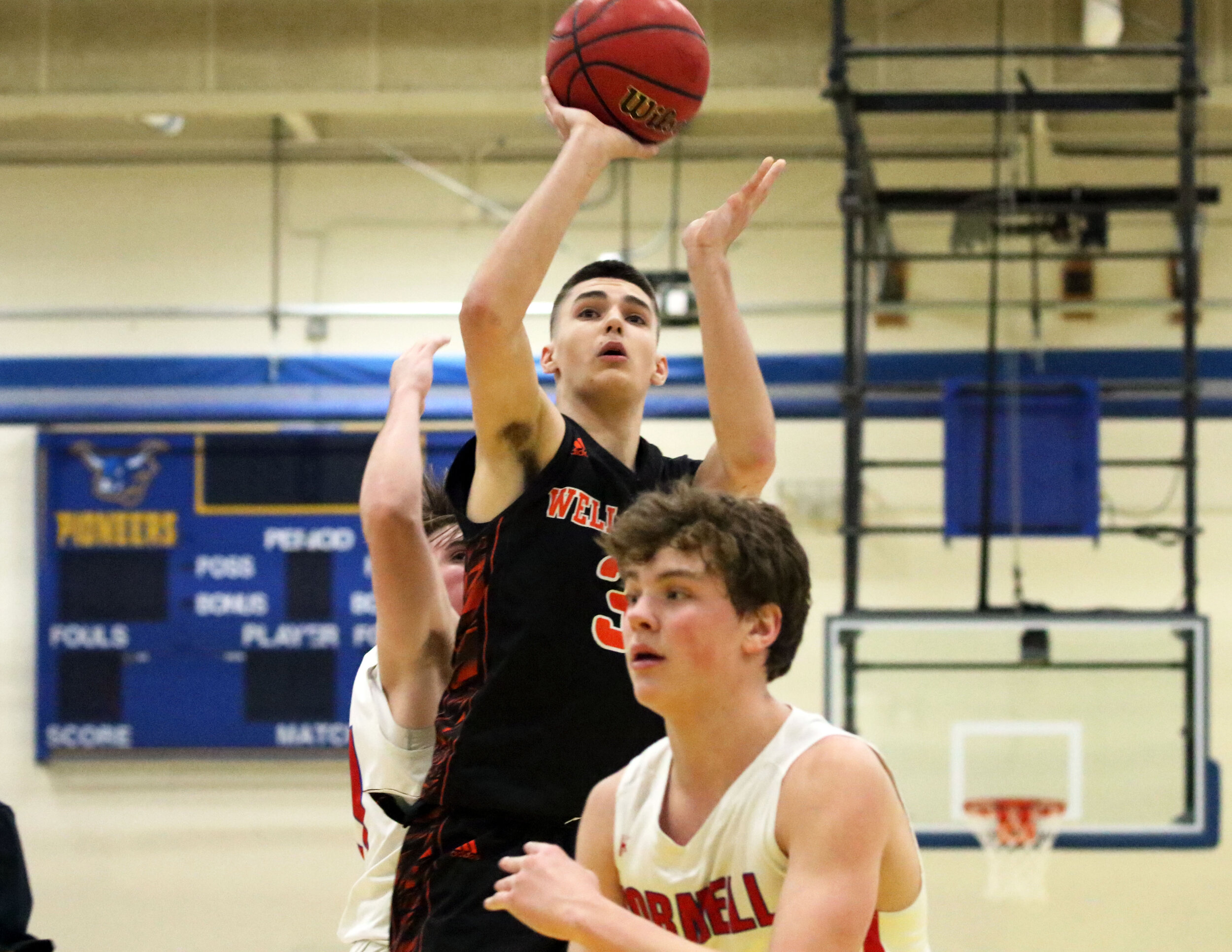  Wellsville senior Max Jusianiec (3) puts up a shot from inside the arc against the Hornell defense during Friday night’s clash in the Barkley Showcase at Alfred State College. [Chris Brooks/WellsvilleSports.com] 