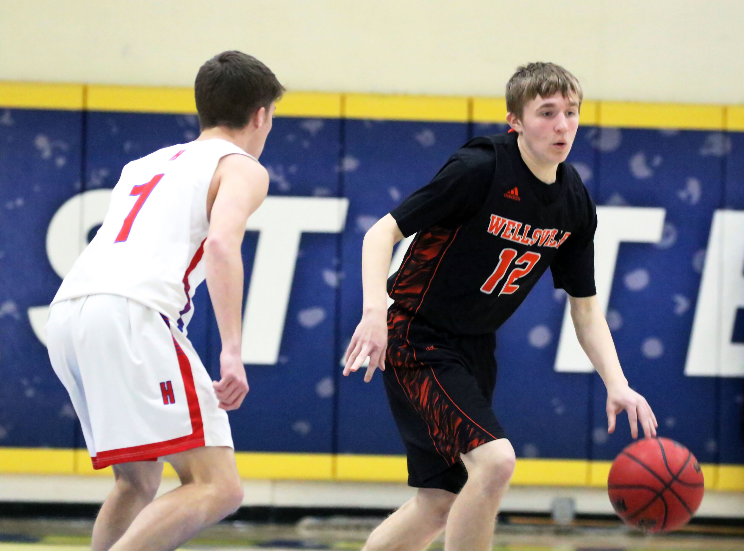  Wellsville junior Liam McKinley (12) dribbles under pressure from the Hornell defense during Friday night’s clash at the Barkley Showcase at Alfred State College. [Chris Brooks/WellsvilleSports.com] 