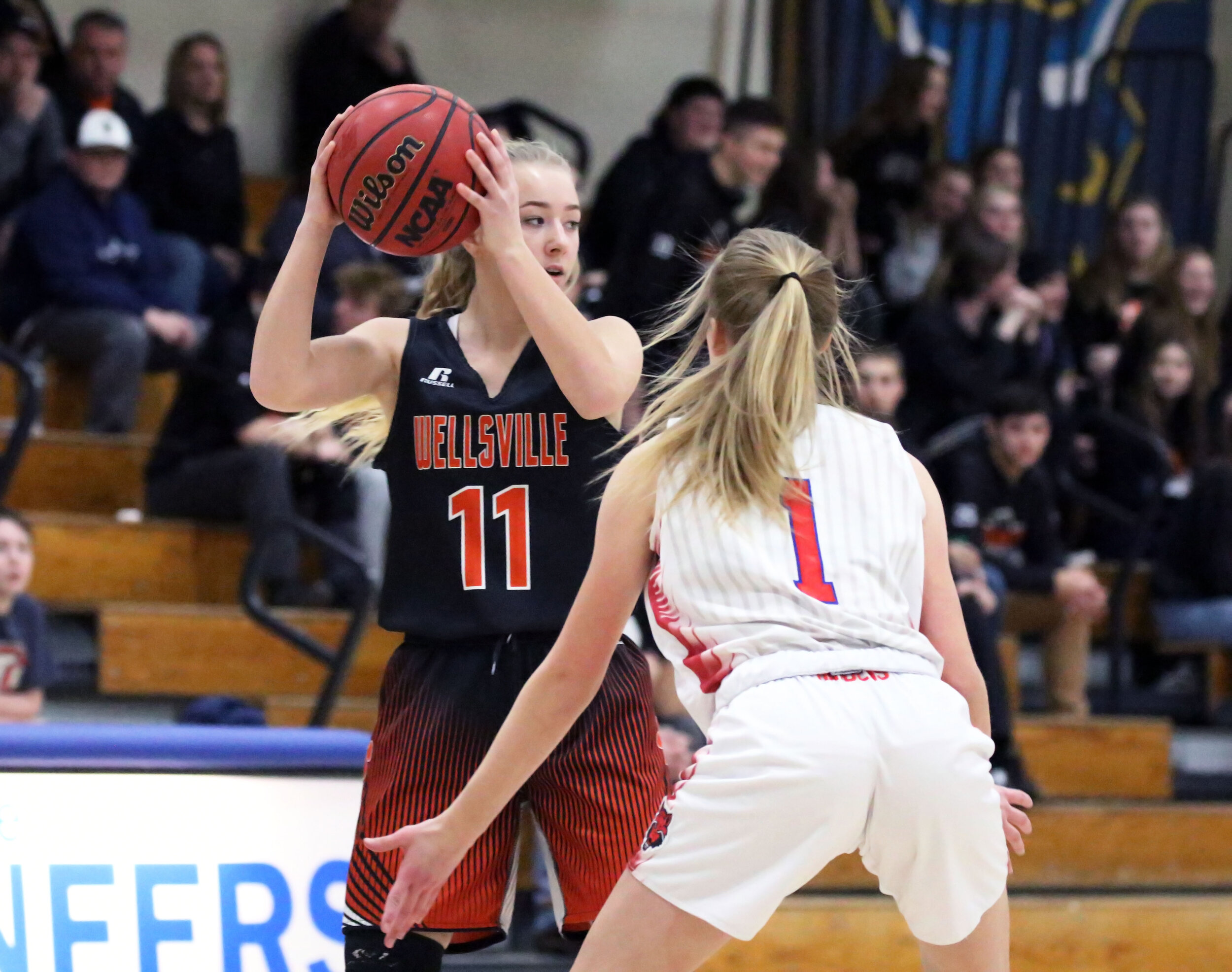  Wellsville sophomore Jaylynn Mess (11) waits for a play to develop in front, as the Hornell defends looks on during Friday night’s clash at the Barkley Showcase at Alfred State College. [Chris Brooks/WellsvilleSports.com] 