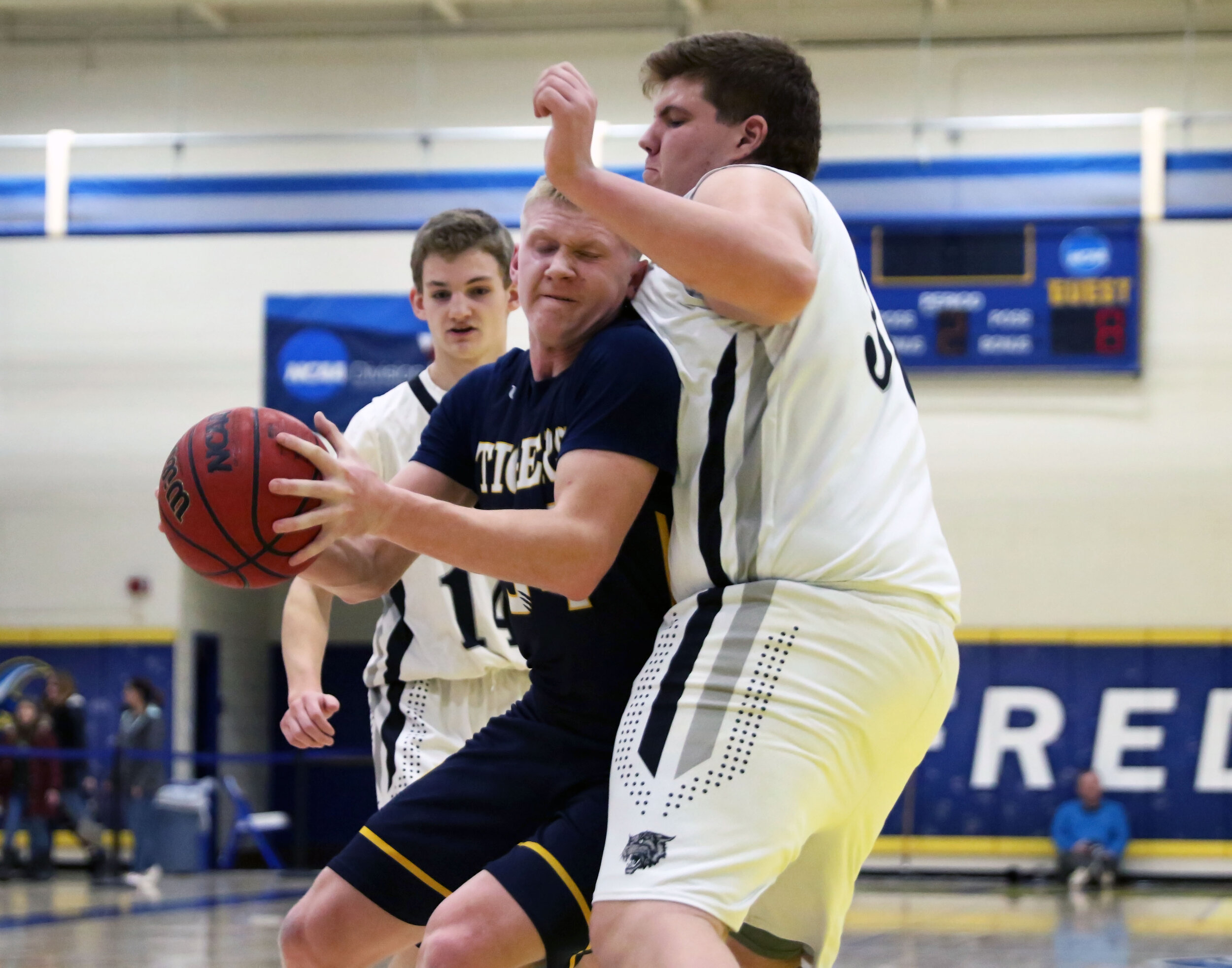  Scio junior Cam Loucks, middle, battles up against the Jasper-Troupsburg defense underneath the basket during game three of the 6th Annual Dan Barkley Showcase at Alfred State College, Saturday evening. [Chris Brooks/WellsvilleSports.com] 