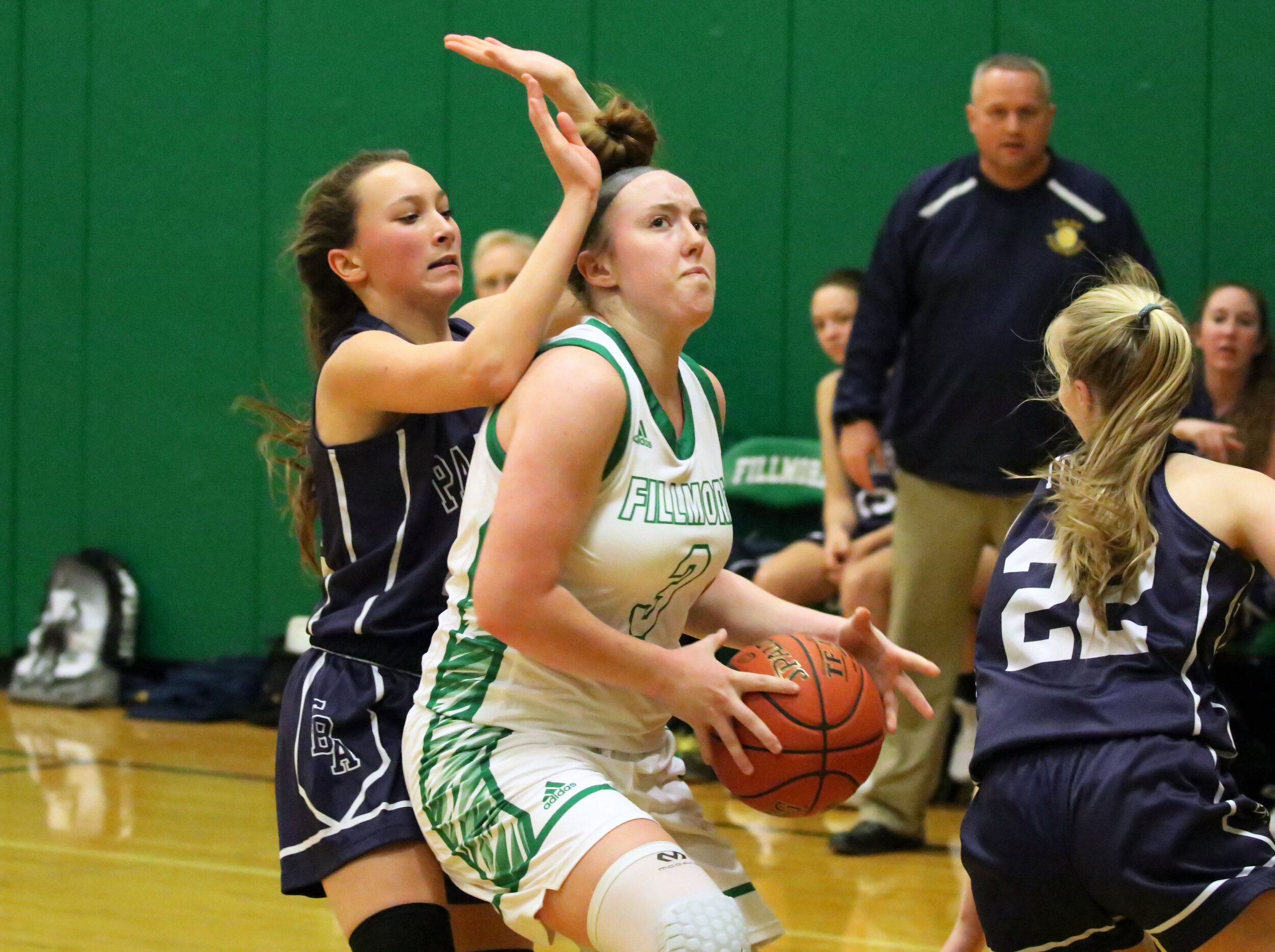  Fillmore senior Riley Voss (3) works her way around the Franklinville defense on her way to the basket during Monday night’s home contest. [Chris Brooks/WellsvilleSports.com] 