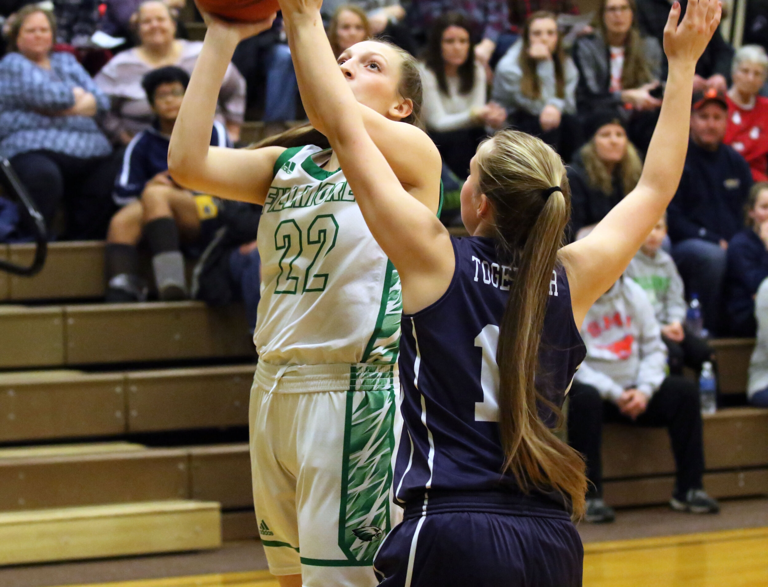  Fillmore senior Carlee Miller (22) puts up a shot underneath the basket, as the Franklinville defense looks to make a block during Monday night’s home contest. [Chris Brooks/WellsvilleSports.com] 