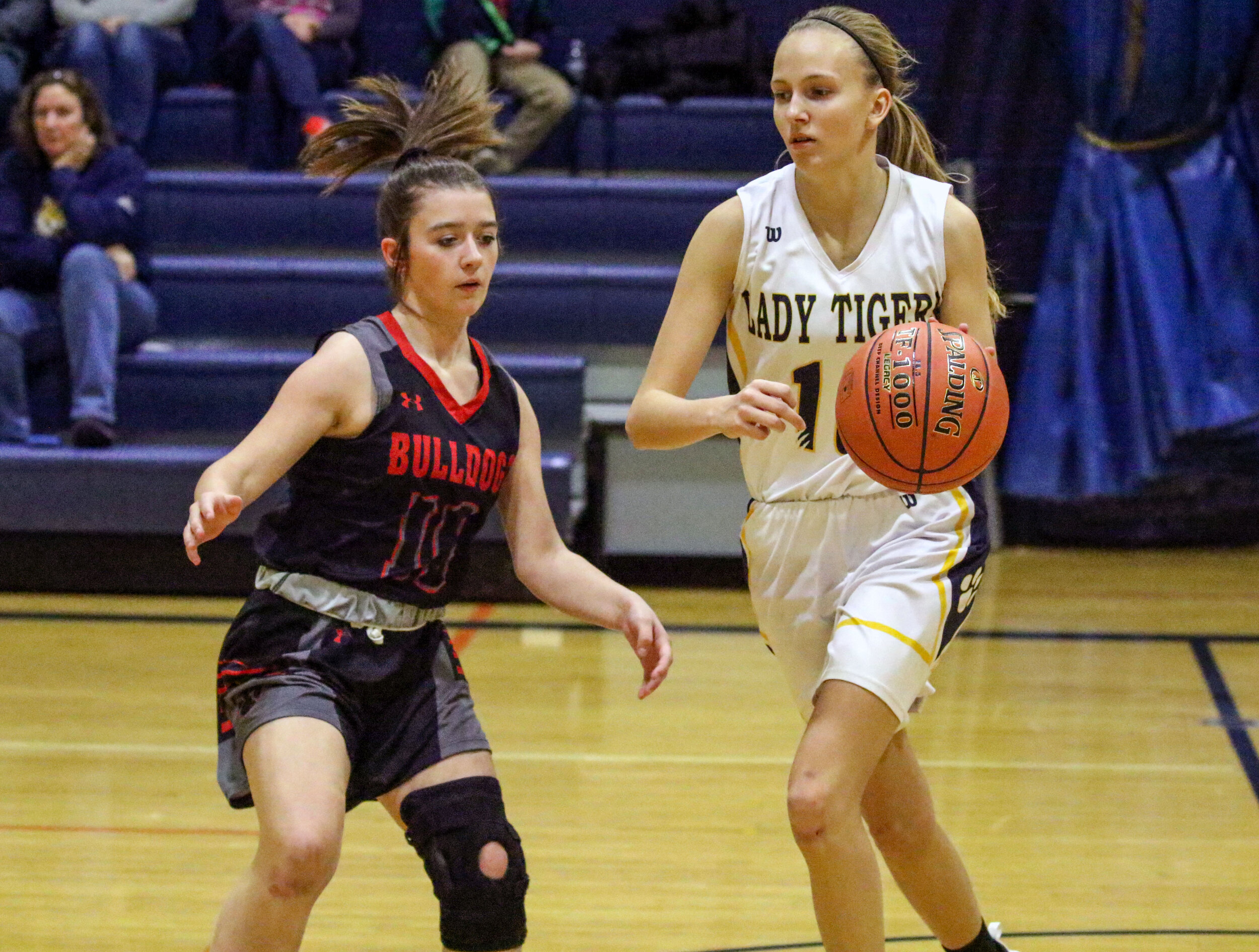  Scio senior Ashlynn Scotchmer, off-center, looks to push the pace up the court against the defense of Belfast freshman Harley Proctor (10) during Friday night’s home contest. [Chris Brooks/WellsvilleSports.com] 
