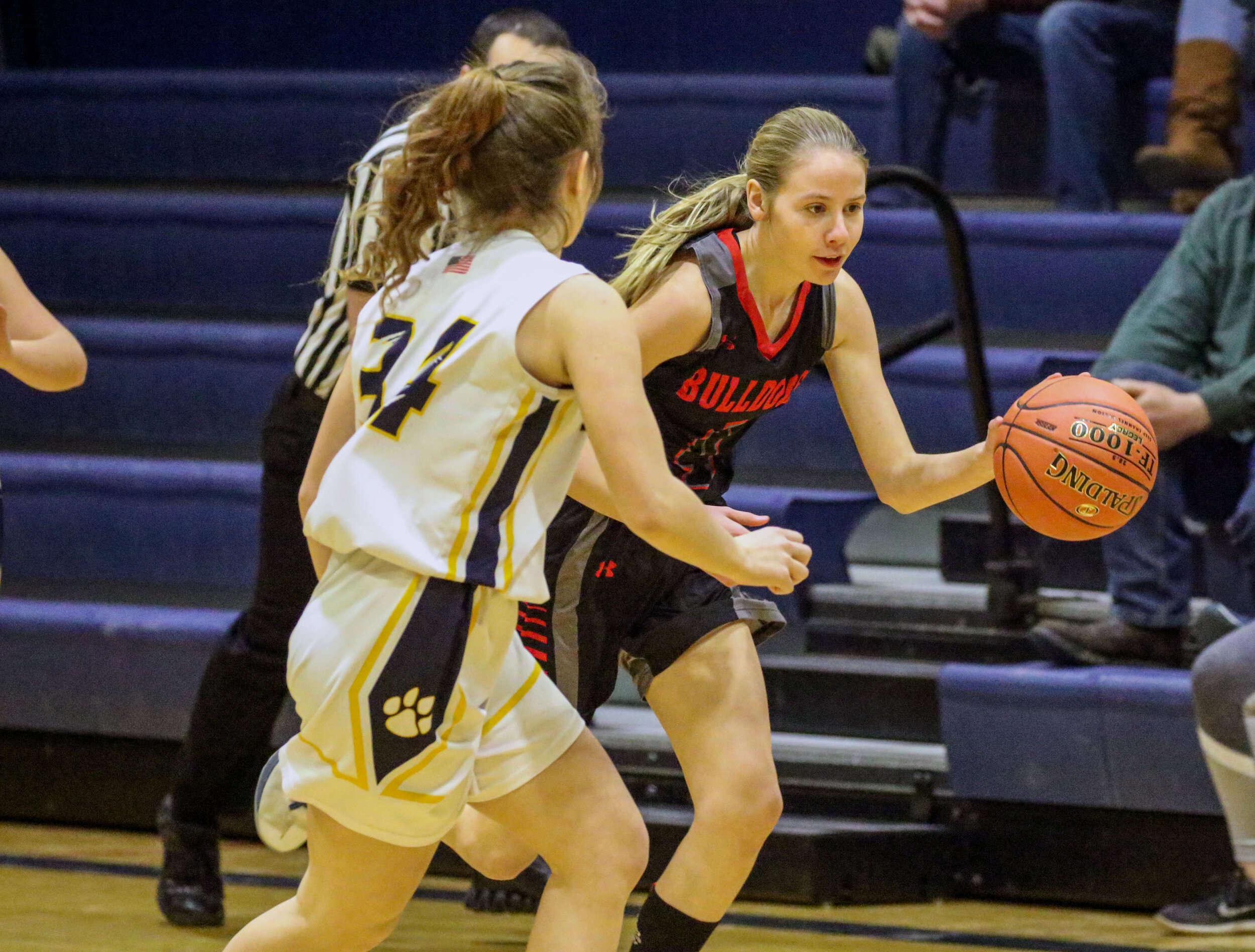  Belfast eighth grader Mary Hamer (4) drives down the sidelines into the offensive zone, as Scio sophomore Melana Davenport (34) races back to defend during Friday night’s road contest in Scio. [Chris Brooks/WellsvilleSports.com] 