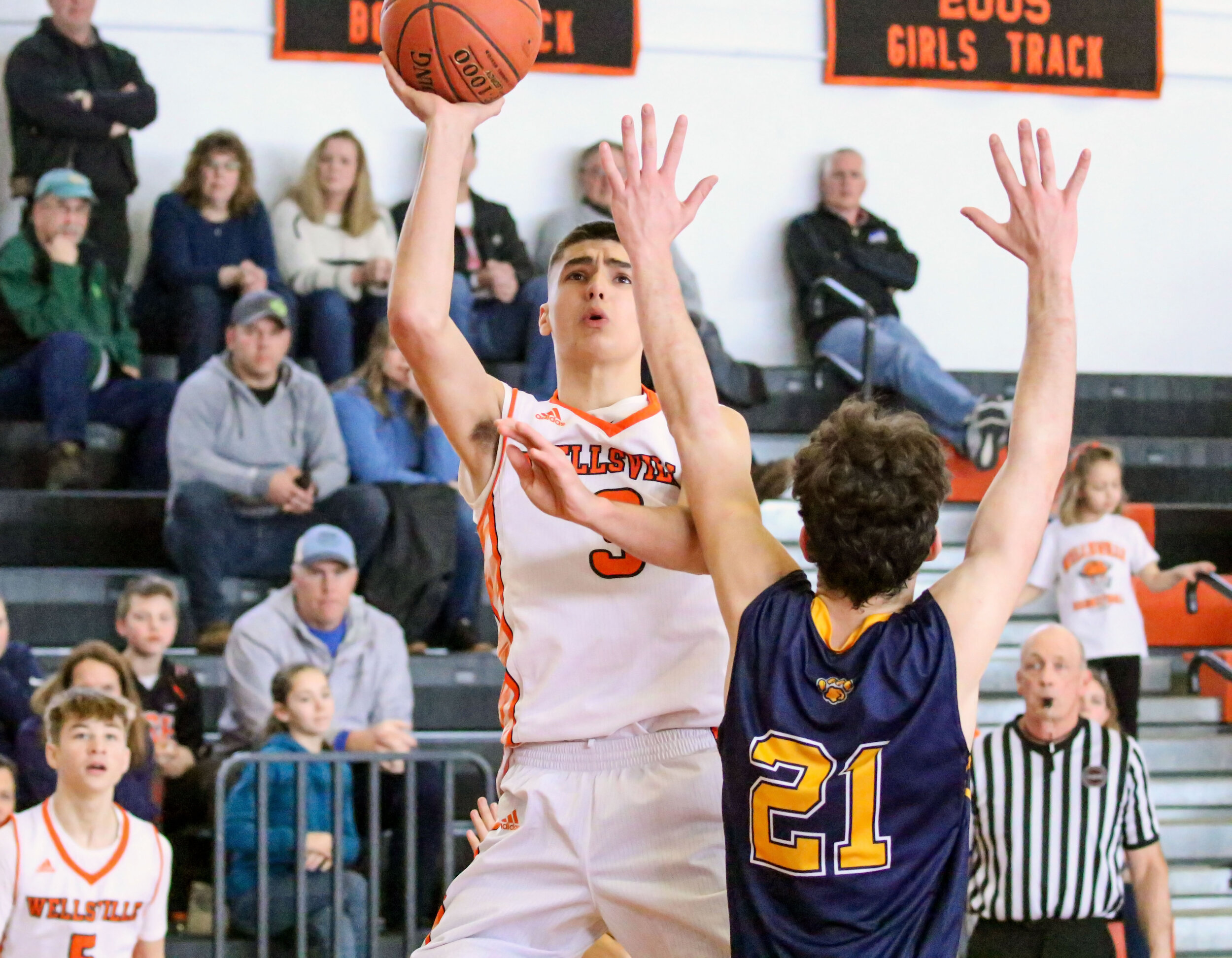  Wellsville senior Max Jusianiec (3) puts up an off-balanced two-point teardrop against the Marcus Whitman defense during Saturday afternoon’s regular season home finale. [Chris Brooks/WellsvilleSports.com] 