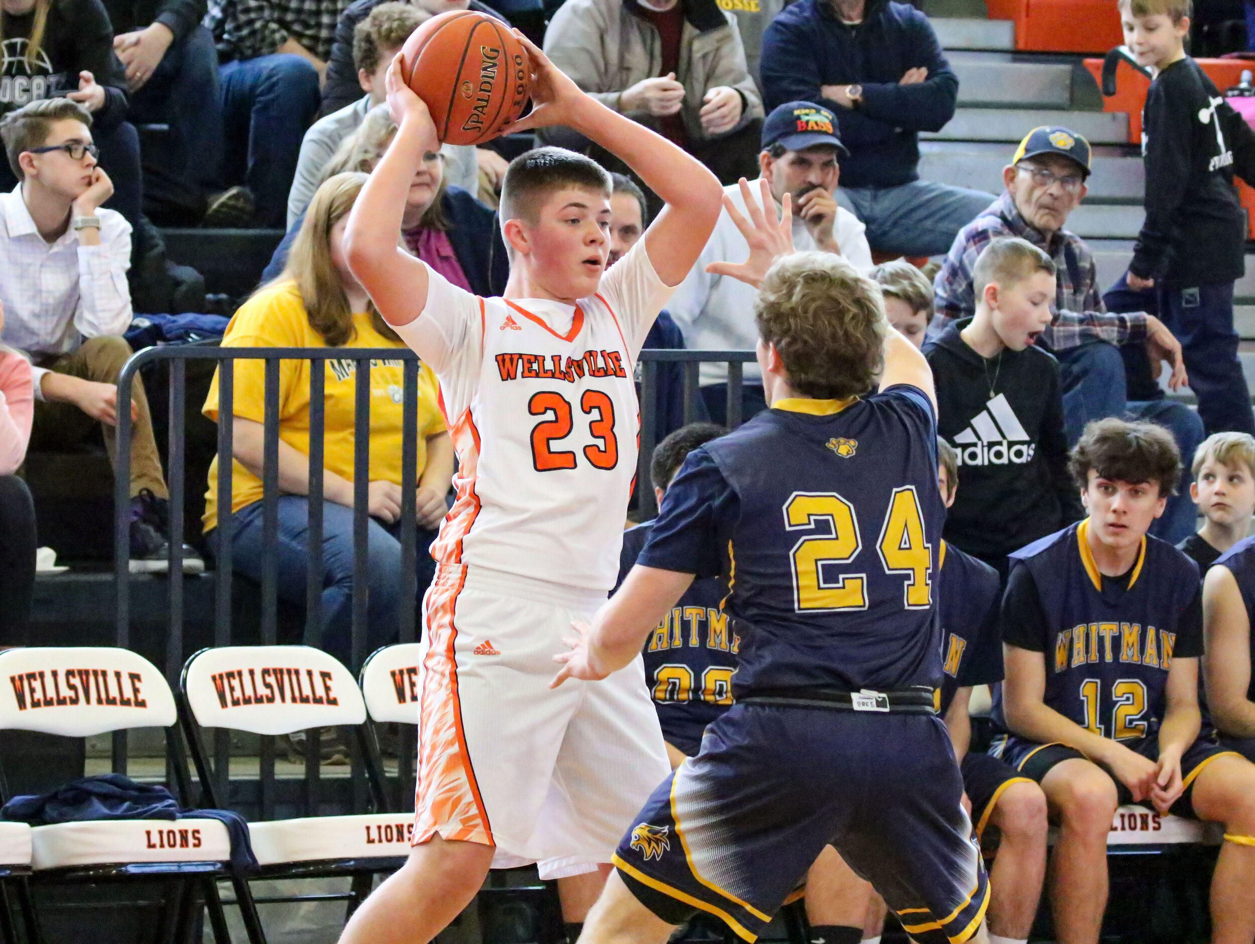  Wellsville freshman Logan Dunbar (23) waits for a play to develop in front, as he looks to make a pass against the Marcus Whitman defense during Saturday afternoon’s regular season home finale. [Chris Brooks/WellsvilleSports.com]  