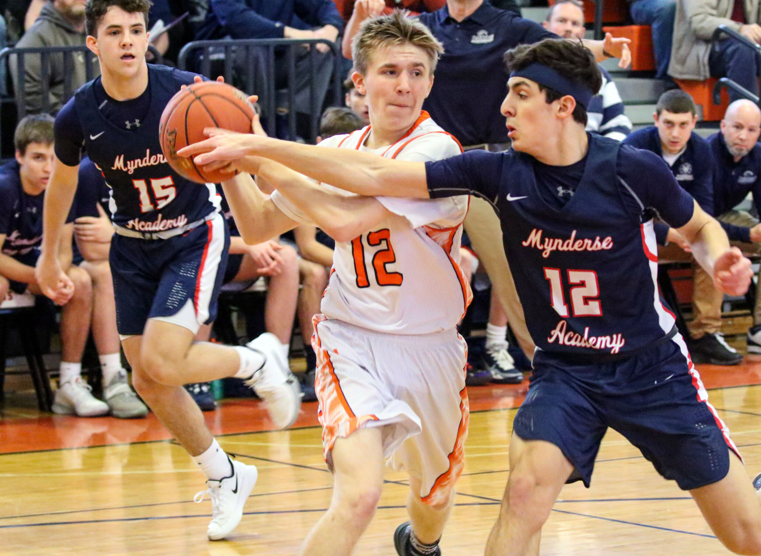  Wellsville junior Liam McKinley, center, looks to make a pass to the inside against the Mynderse defense on his drive during Saturday afternoon’s Class B2 Quarterfinal matchup in Wellsville. [Chris Brooks/WellsvilleSports.com] 