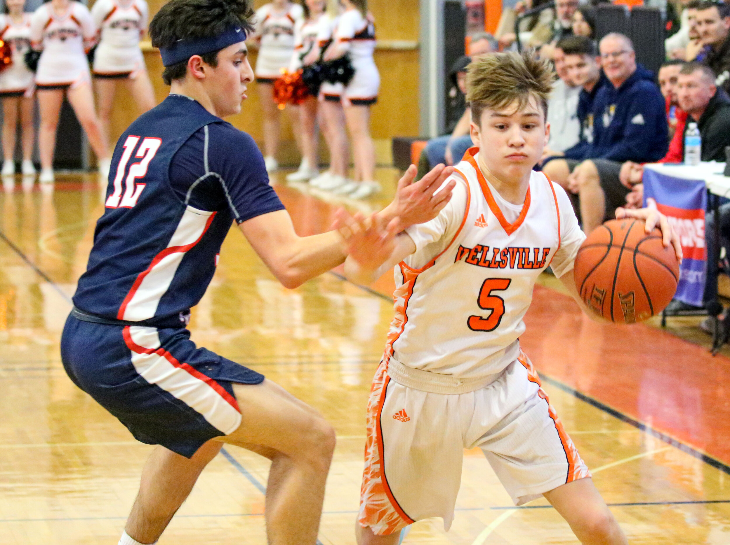  Wellsville sophomore Eli Schmidt (5) drives his way around the Mynderse defense on his way inside during Saturday afternoon’s Class B2 Quarterfinal matchup in Wellsville. [Chris Brooks/WellsvilleSports.com] 