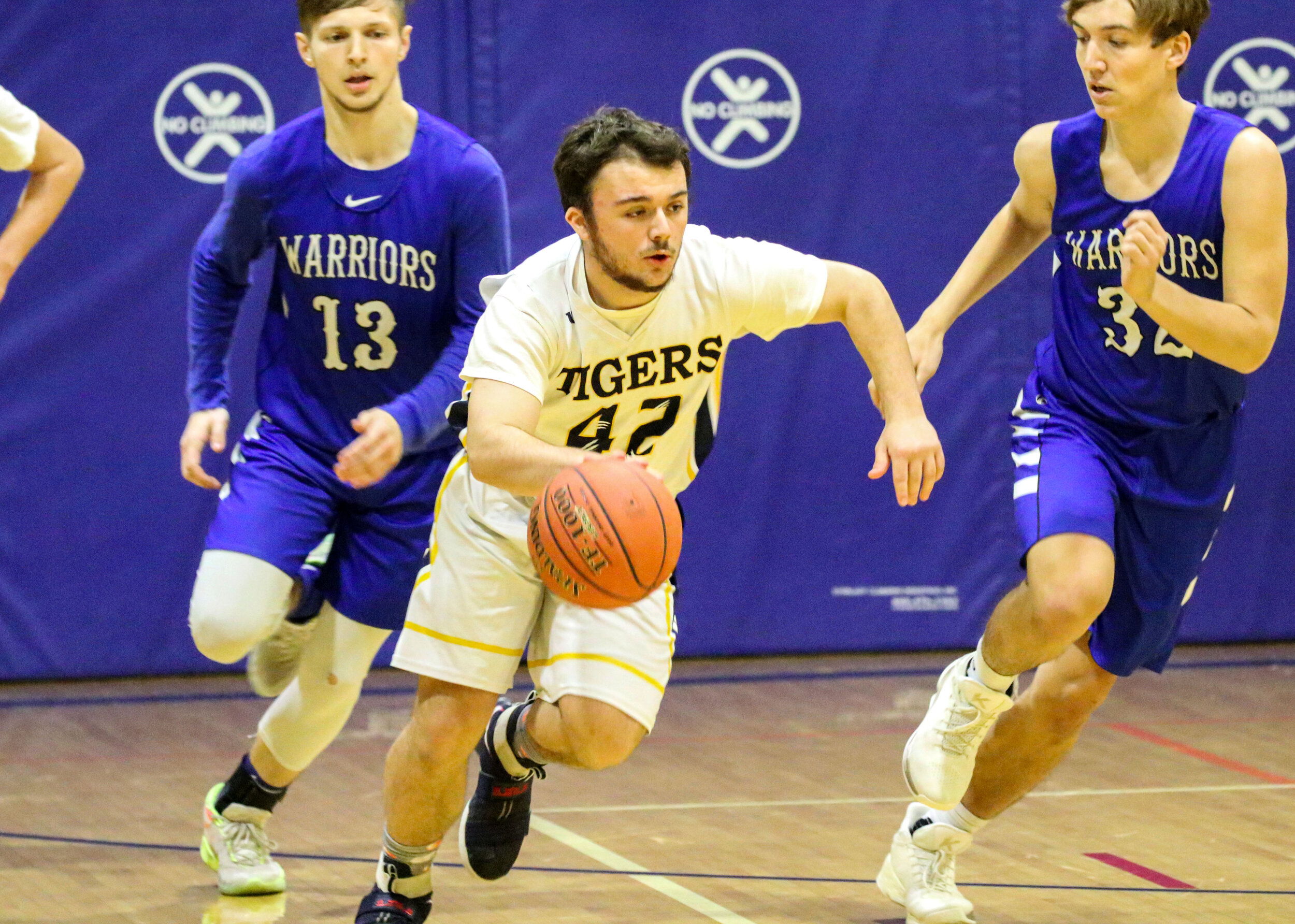  Scio senior Jake D’Arcy (42) pushes the pace back downcourt, as the Romulus defense races back to defend during Saturday night’s Class D2 Quarterfinal contest in Scio. [Chris Brooks/WellsvilleSports.com] 