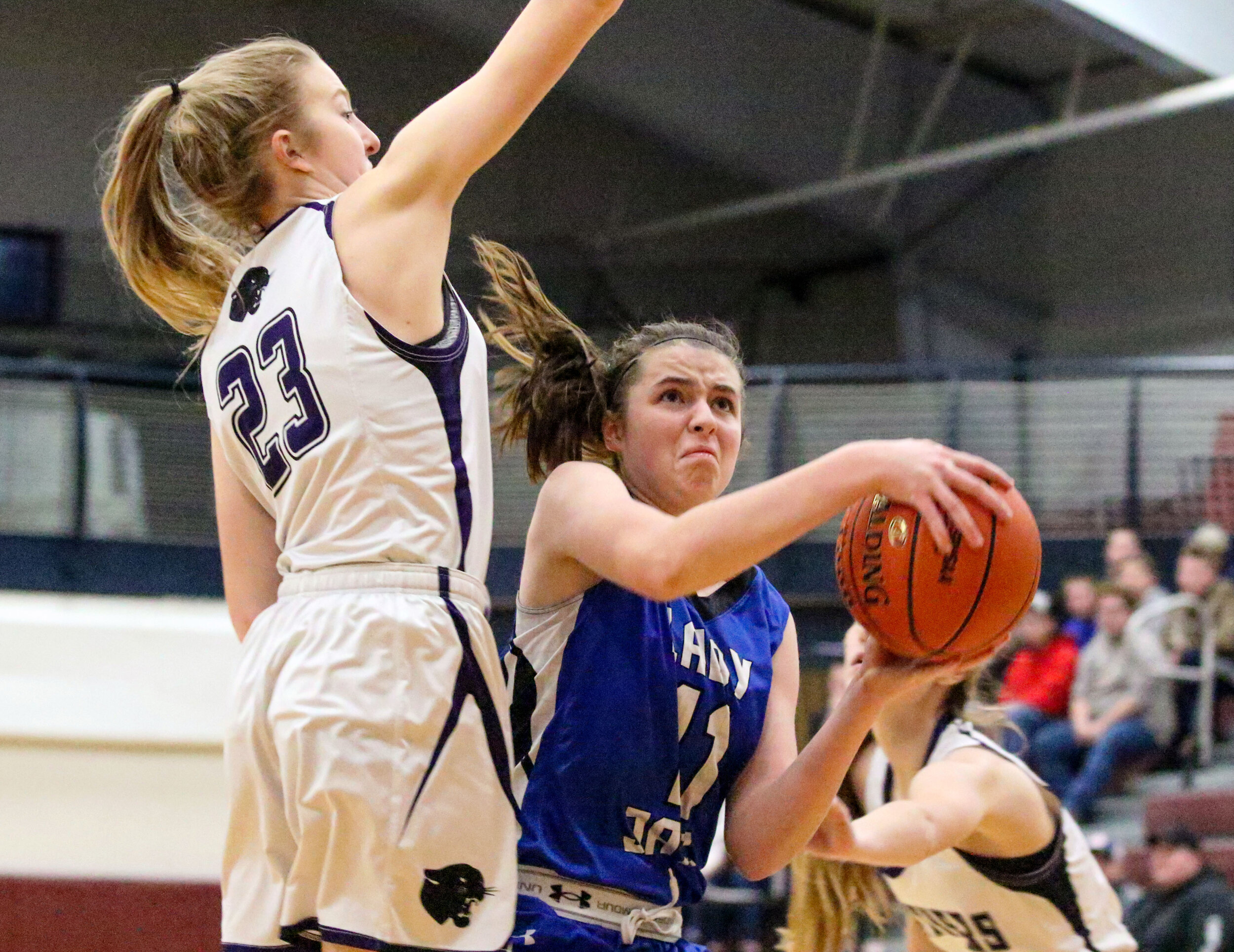  Whitesville freshman Vanessa Hall (11) drives her way up to the basket against the defense of Andover junior Kelsie Niedermaier (23) during Monday night’s Class D2 Semifinal at Wayland-Cohocton. [Chris Brooks/WellsvilleSports.com] 