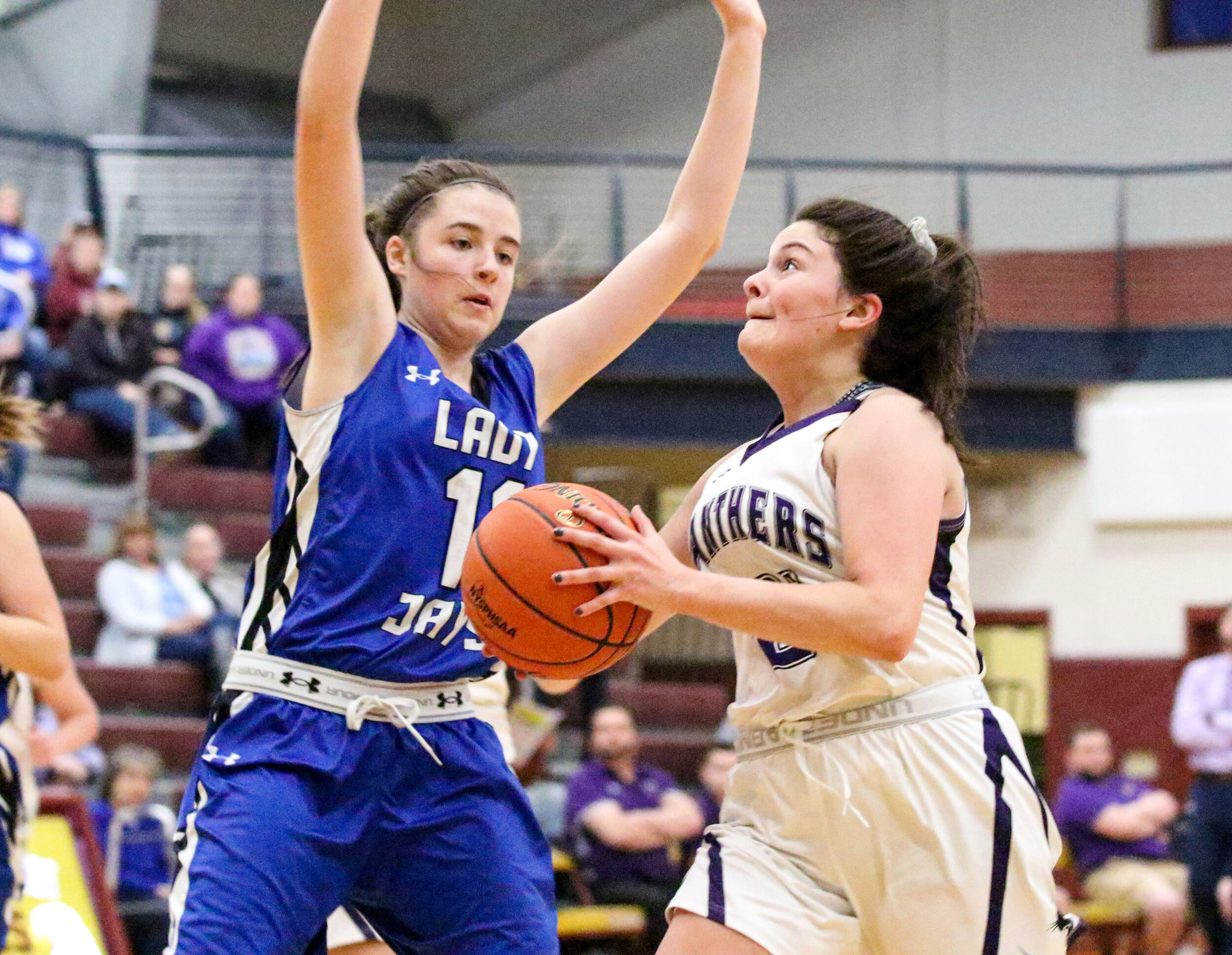  Andover senior Emily Wahl, right, looks to drive her way inside against the defense of Whitesville freshman Vanessa Hall, left, during Monday night’s Class D2 Semifinal at Wayland-Cohocton. [Chris Brooks/WellsvilleSports.com] 