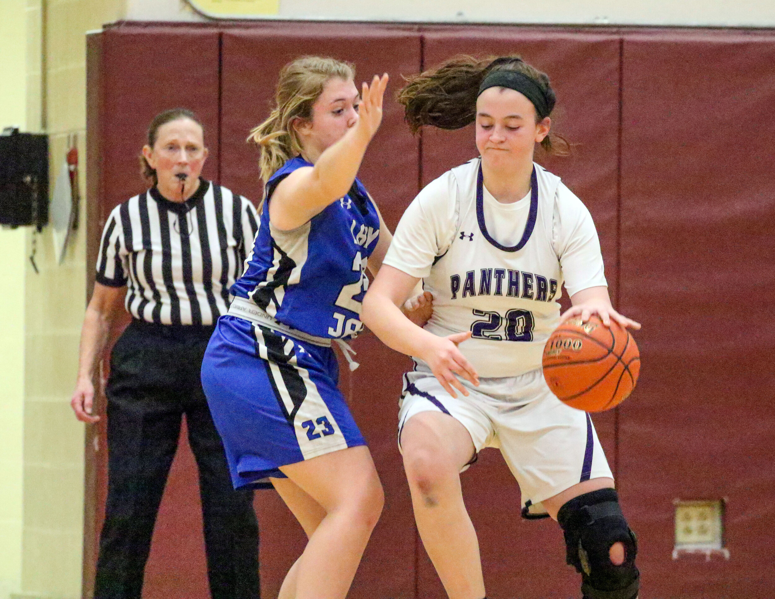  Andover junior Livia Simon (20) looks to work around the defense of Whitesville junior Serina Button, left, on her way inside during Monday night’s Class D2 Semifinal at Wayland-Cohocton. [Chris Brooks/WellsvilleSports.com] 