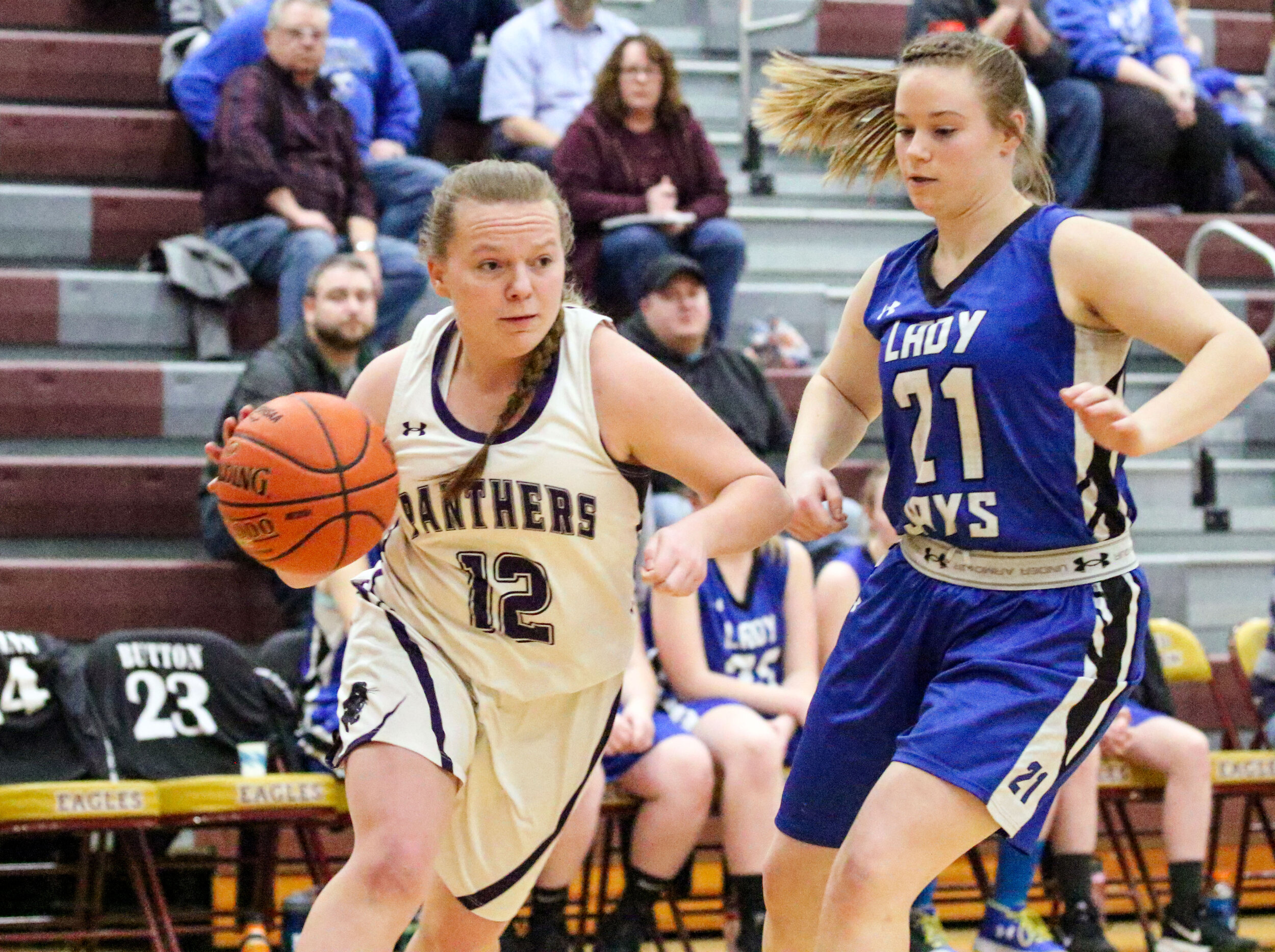  Andover senior Katie Calladine (12) drives the baseline toward the basket against the defense of Whitesville junior Kate Pensyl (21) during Monday night’s Class D2 Semifinal contest at Wayland-Cohocton. [Chris Brooks/WellsvilleSports.com] 