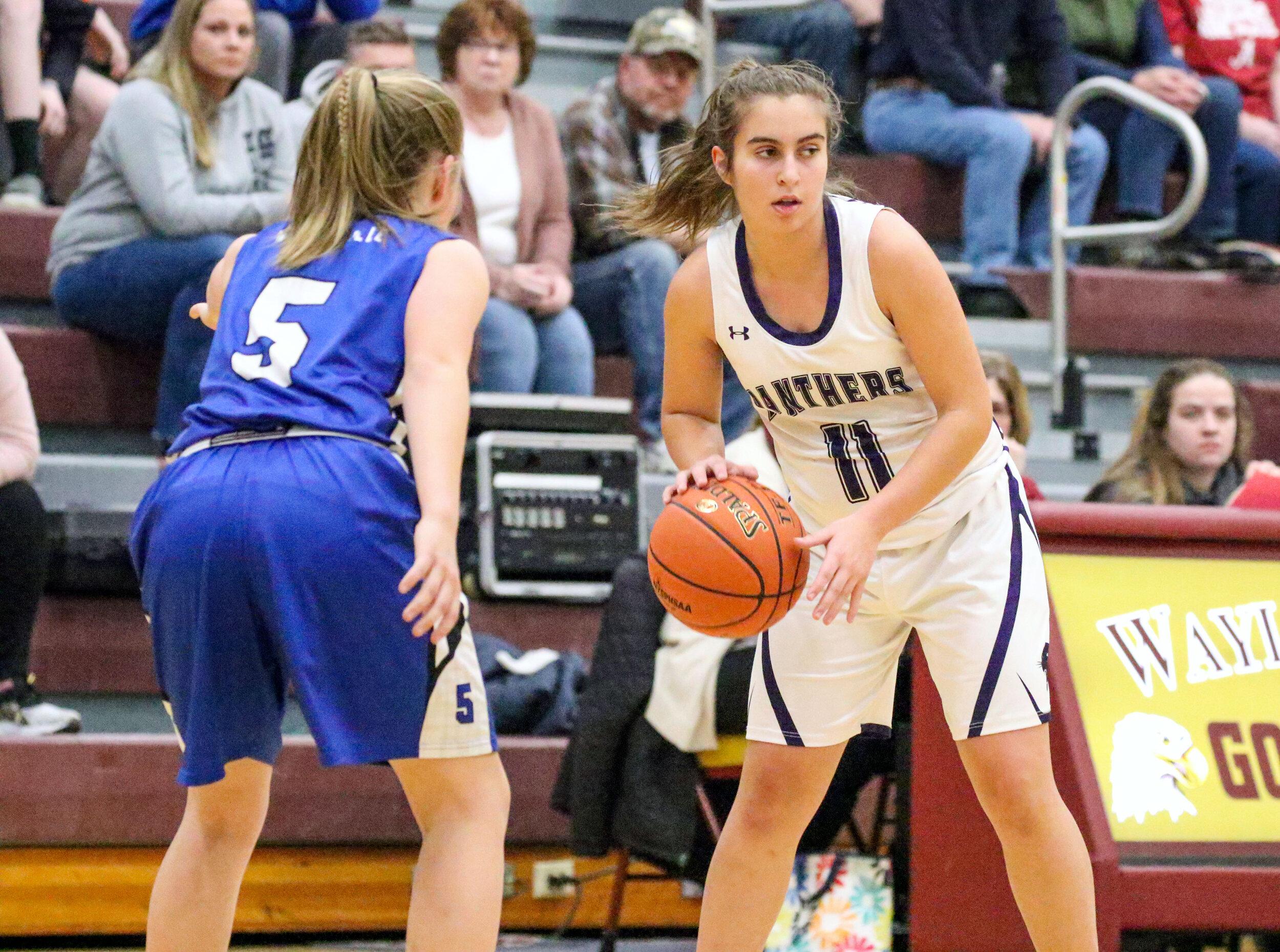  Andover sophomore Tess Spangenburg (11) waits for a play to develop in front, as Whitesville sophomore Rachel Jackson (5) keeps watch during Monday night’s Class D2 Semifinal contest at Wayland-Cohocton. [Chris Brooks/WellsvilleSports.com] 