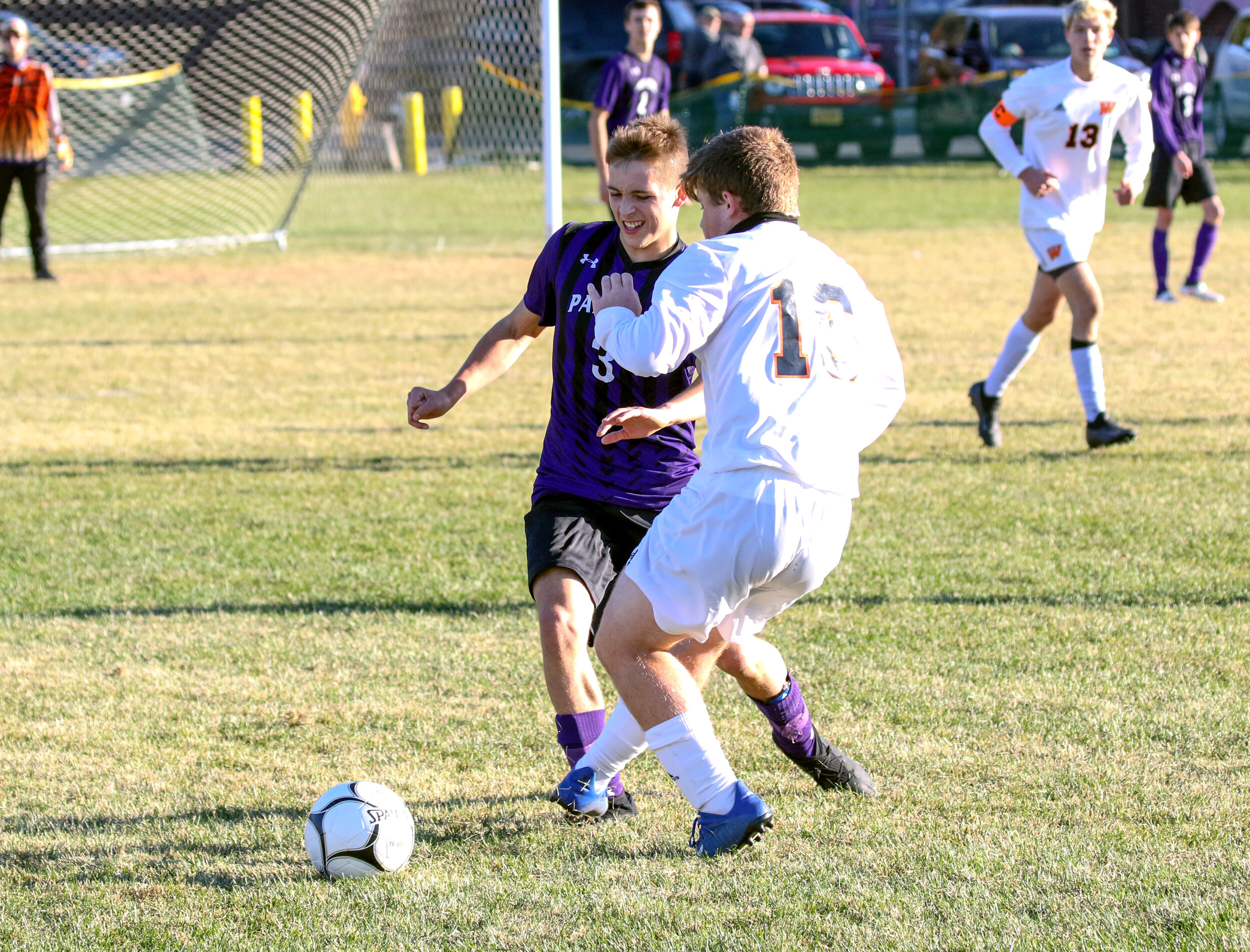  Andover/Whitesville sophomore CJ Estep (3) and Wellsville senior Jake Schrlau (16) race after the loose ball at midfield during Saturday afternoon’s contest in Andover. [Chris Brooks/WellsvilleSports.com] 