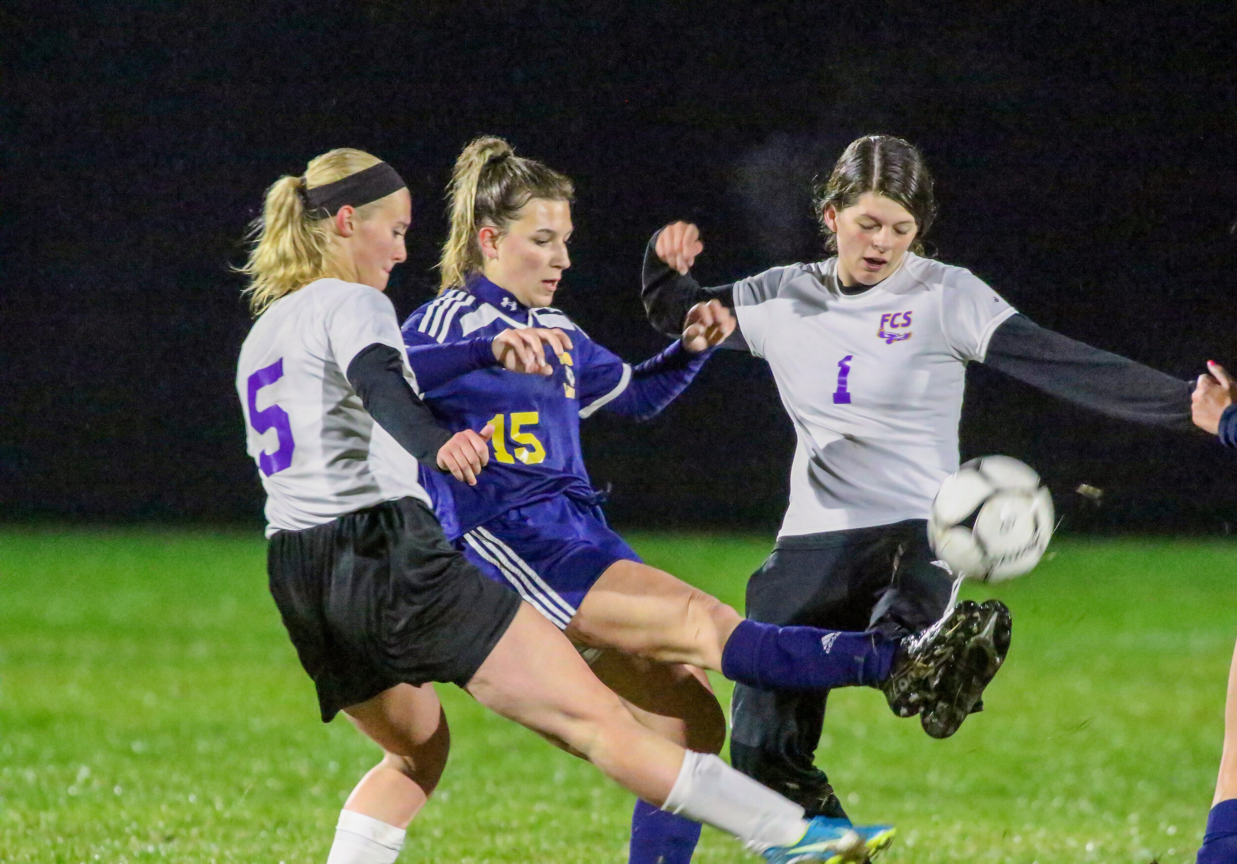  Scio junior Melana Davenport (15) battles in between the Friendship defense of senior Emily Burdick (5), and freshman Nevaeh Ross (1) for the loose ball at midfield during Tuesday night’s contest in Scio. [Chris Brooks/WellsvilleSports.com] 