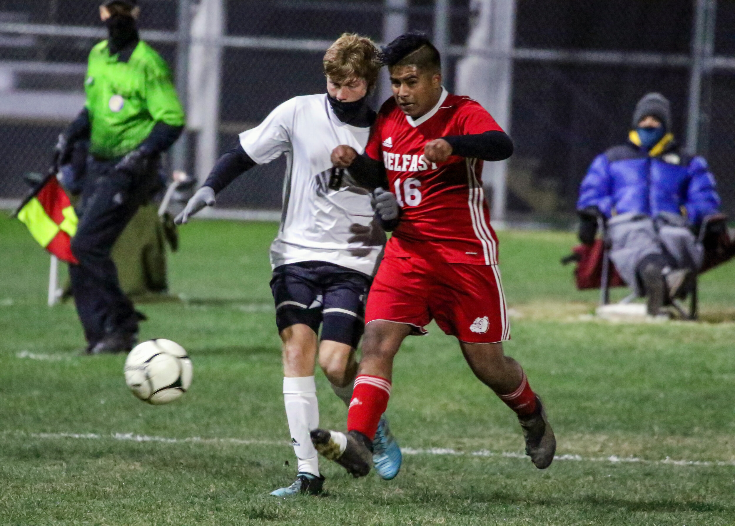  Belfast senior Stiven Lopez (16) jousts with the Jasper-Troupsburg defense for the loose ball in the offensive zone during Wednesday night’s Class D2 Finals matchup in Belfast. [Chris Brooks/WellsvilleSports.com] 
