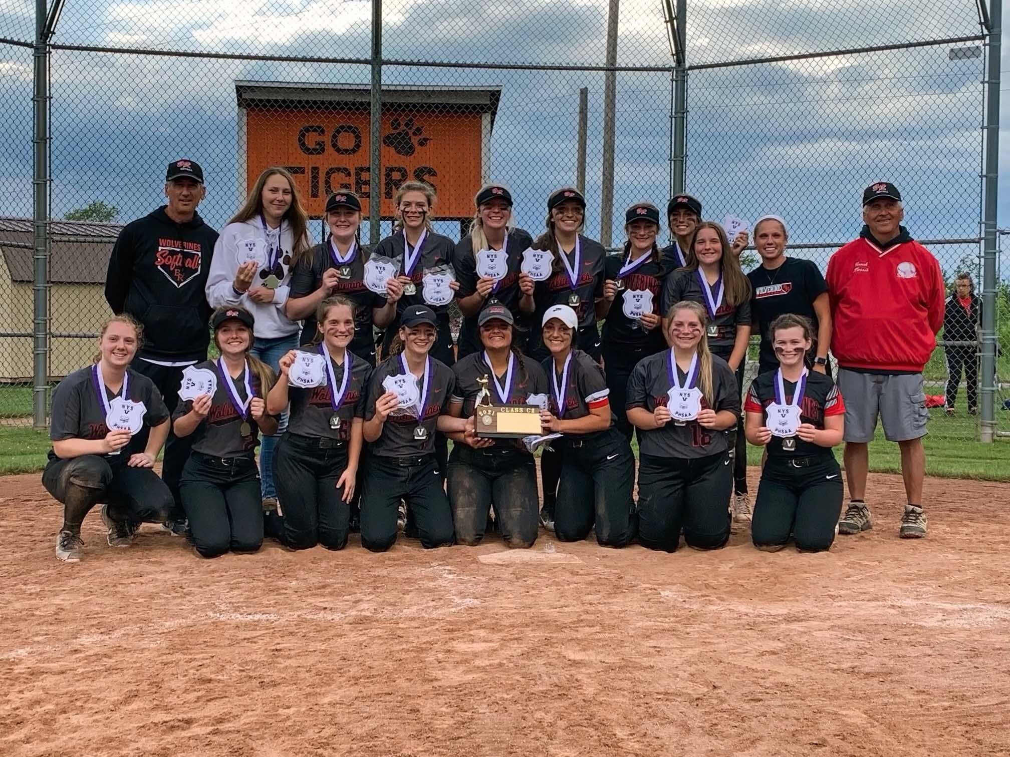  The Lady Wolverines of Bolivar-Richburg come together for a group photo with their newly acquired Class C2 Championship brick after defeating No. 1 Lyndonville by a 9-7 count to seize their first title since the 2015 season on Monday in Lyndonville.