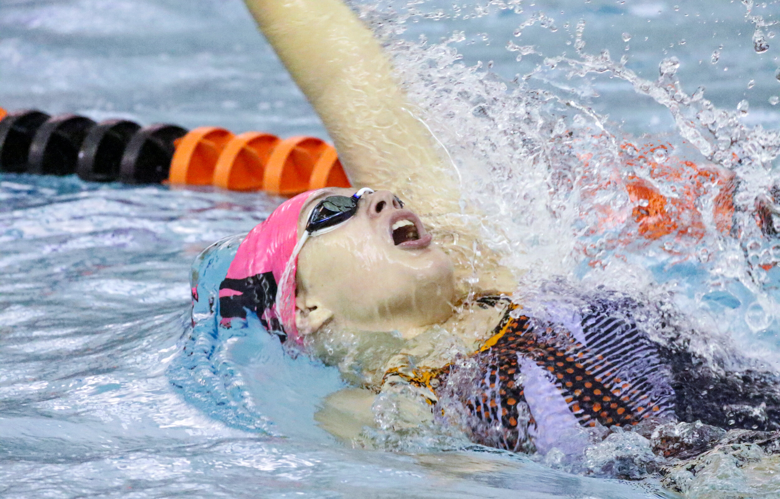  Wellsville’s Tiernee Brandes surfaces for air during the 200 medley relay event of Saturday morning’s regular season finale against Hornell, in Wellsville. [Chris Brooks/WellsvilleSports.com] 