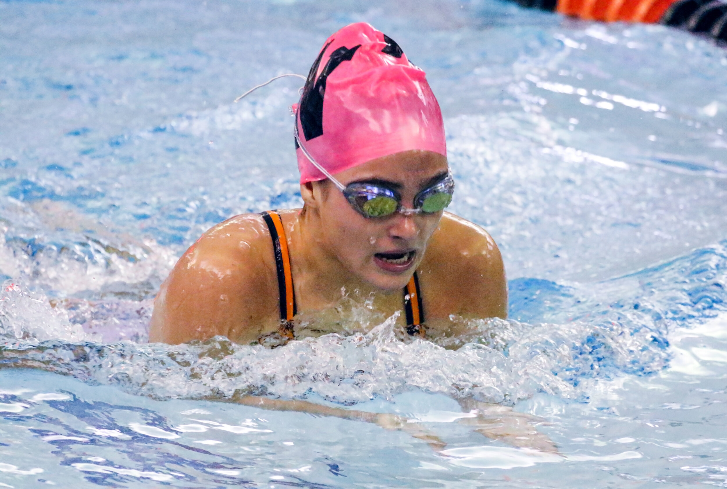  Wellsville’s Isabelle Hart surfaces for air while competing in the 200 individual medley relay event of Saturday morning’s regular season finale against Hornell, in Wellsville. [Chris Brooks/WellsvilleSports.com] 