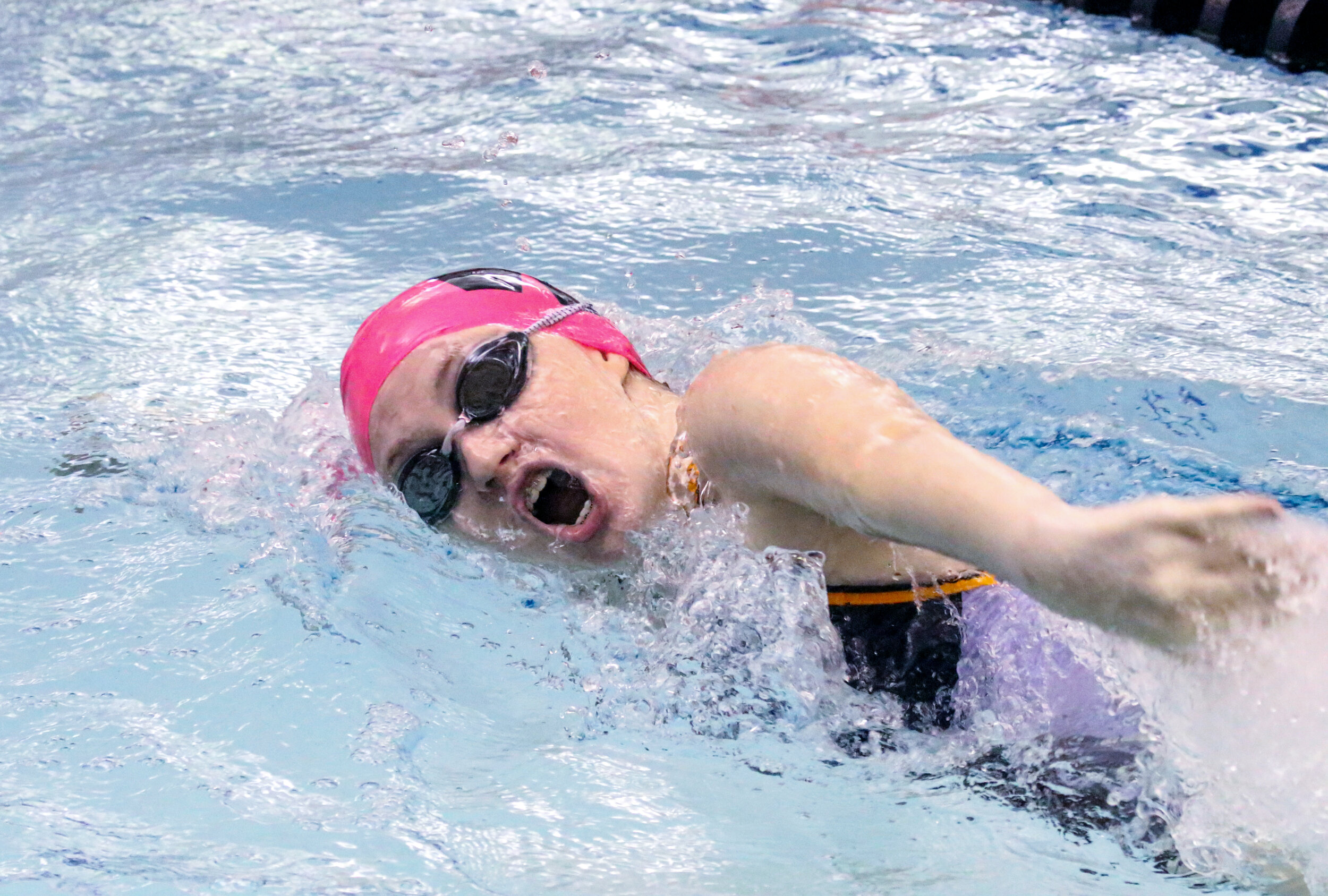  Wellsville’s Megan VanEtten takes in a fresh breath of air during the 50 freestyle event of Saturday morning’s regular season finale against Hornell, in Wellsville. [Chris Brooks/WellsvilleSports.com] 