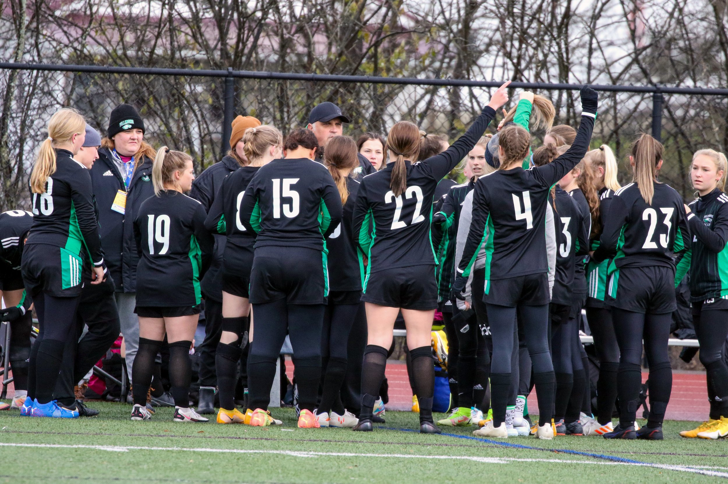  In this file photo, Fillmore head coach Jon Beardsley, off-center, talks with his team before they take the field for their Class D Final Four matchup against Mount Academy in Cortland. The Lady Eagles finished a remarkable 2021 season with a record